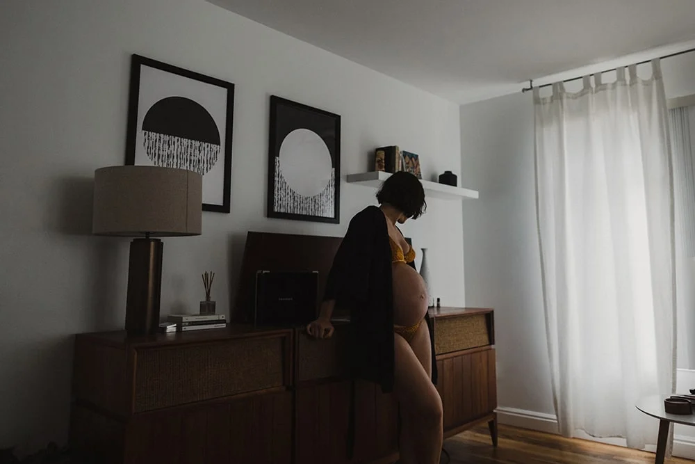 woman showing her pregnancy in her portland home