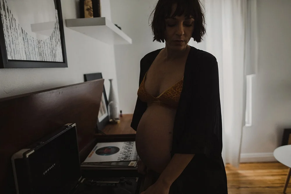 short haired girl playing record