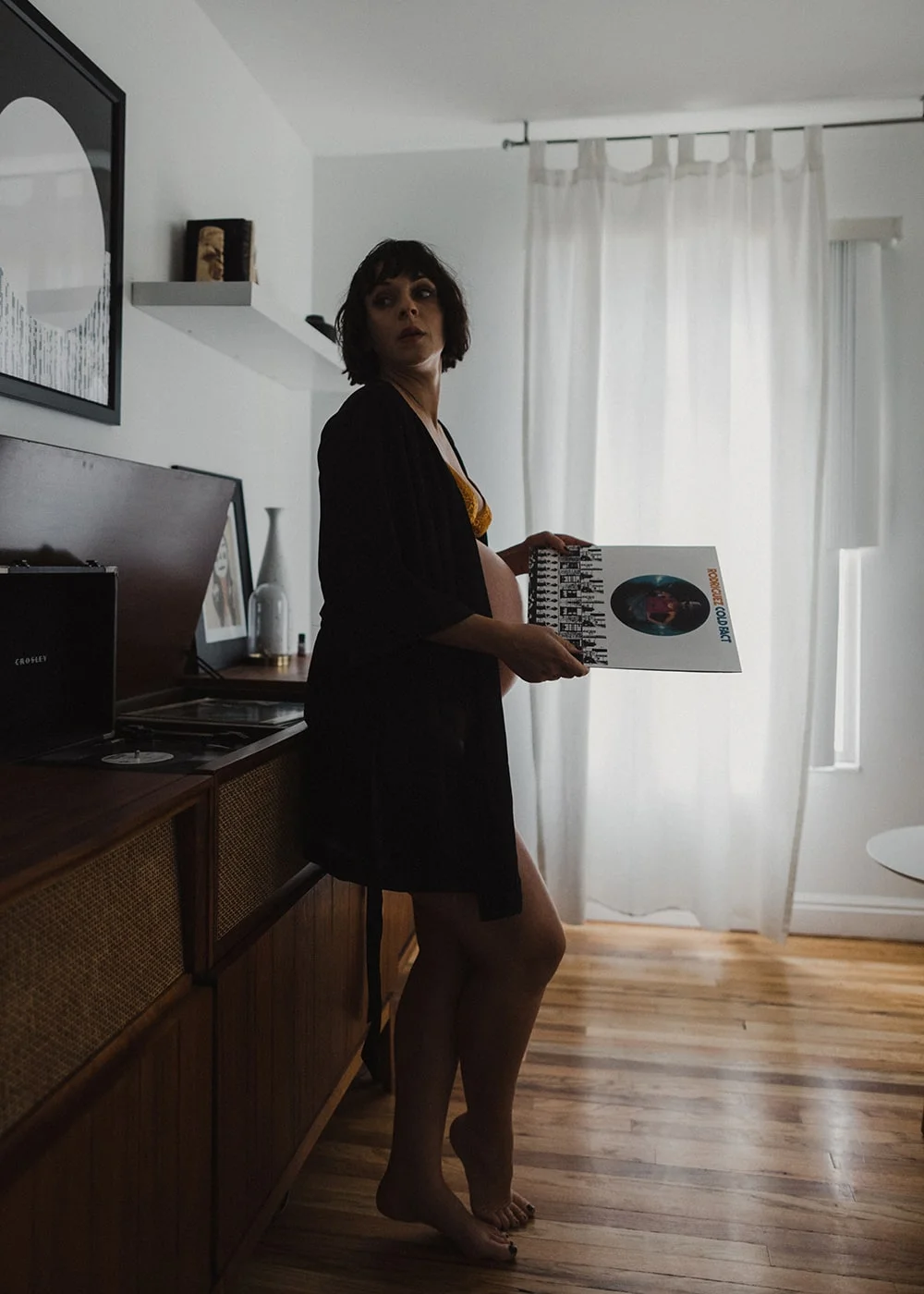 woman looking at record and relaxing