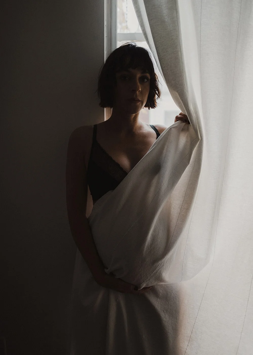 woman looking at camera in portland apartment