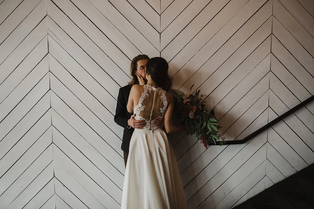 couple kissing at union pine before wedding ceremony