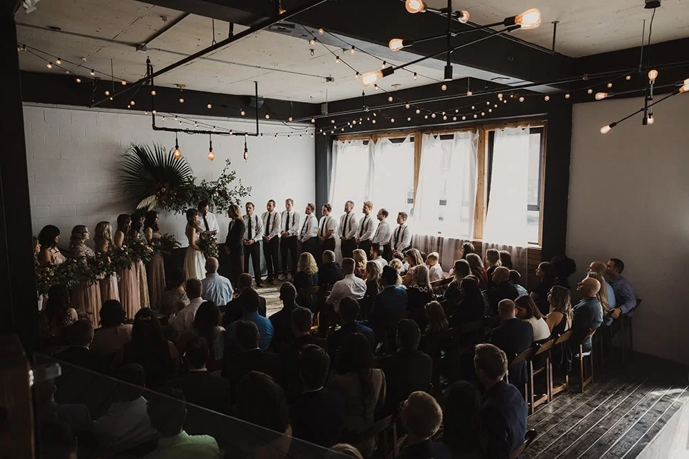wedding ceremony with dim lighting and strong windows