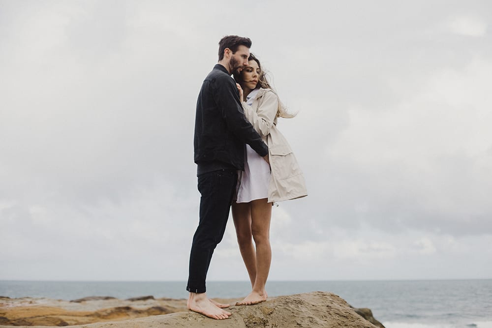 guy wearing black holding girl wearing white