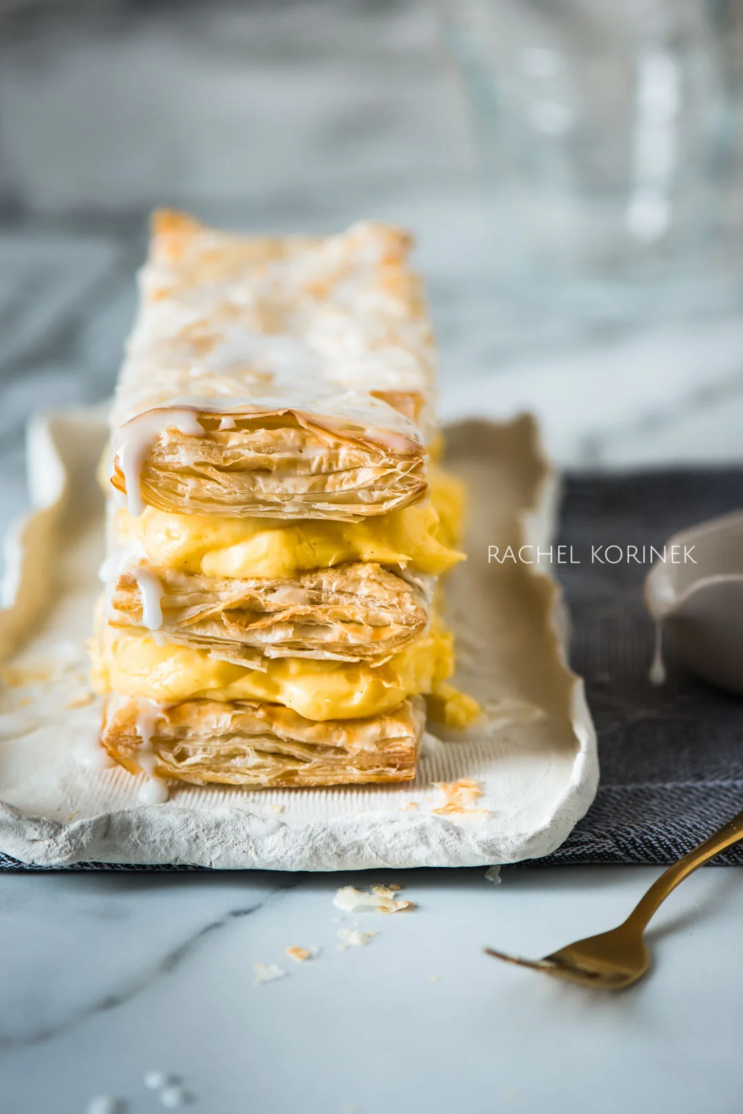 Rachel Korinek Melbourne Food Photographer Vanilla Slice Click to check out my latest food photography projects. #twolovesstudio #beautifulcuisine #foodbloggerpro #foodphotography #learnfoodphotography #foodblogger #learnphotography #foodstyling #lightingtips #naturallight #foodphotographer