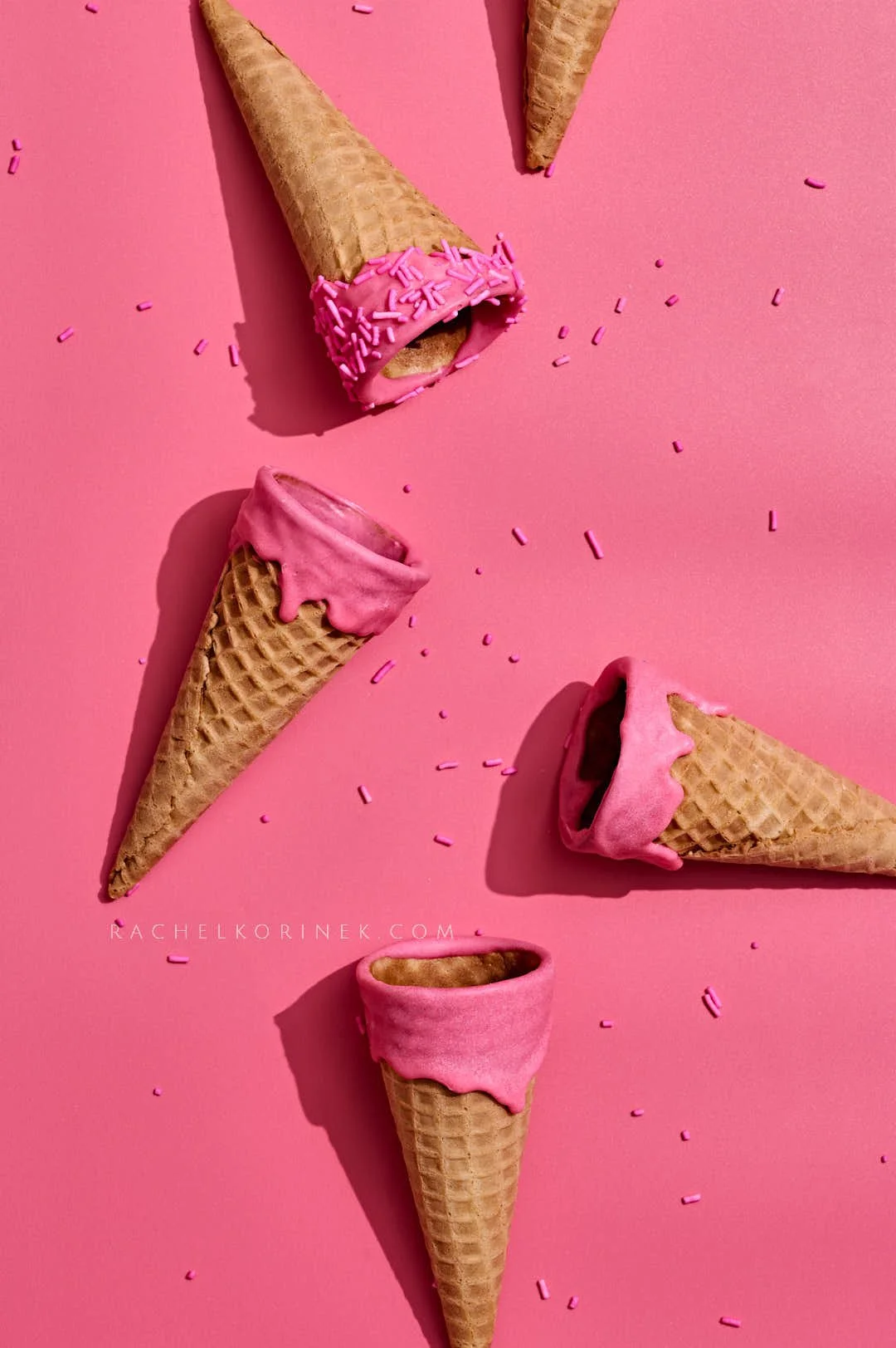  Pink ice cream cones on a bright pink backdrop. 