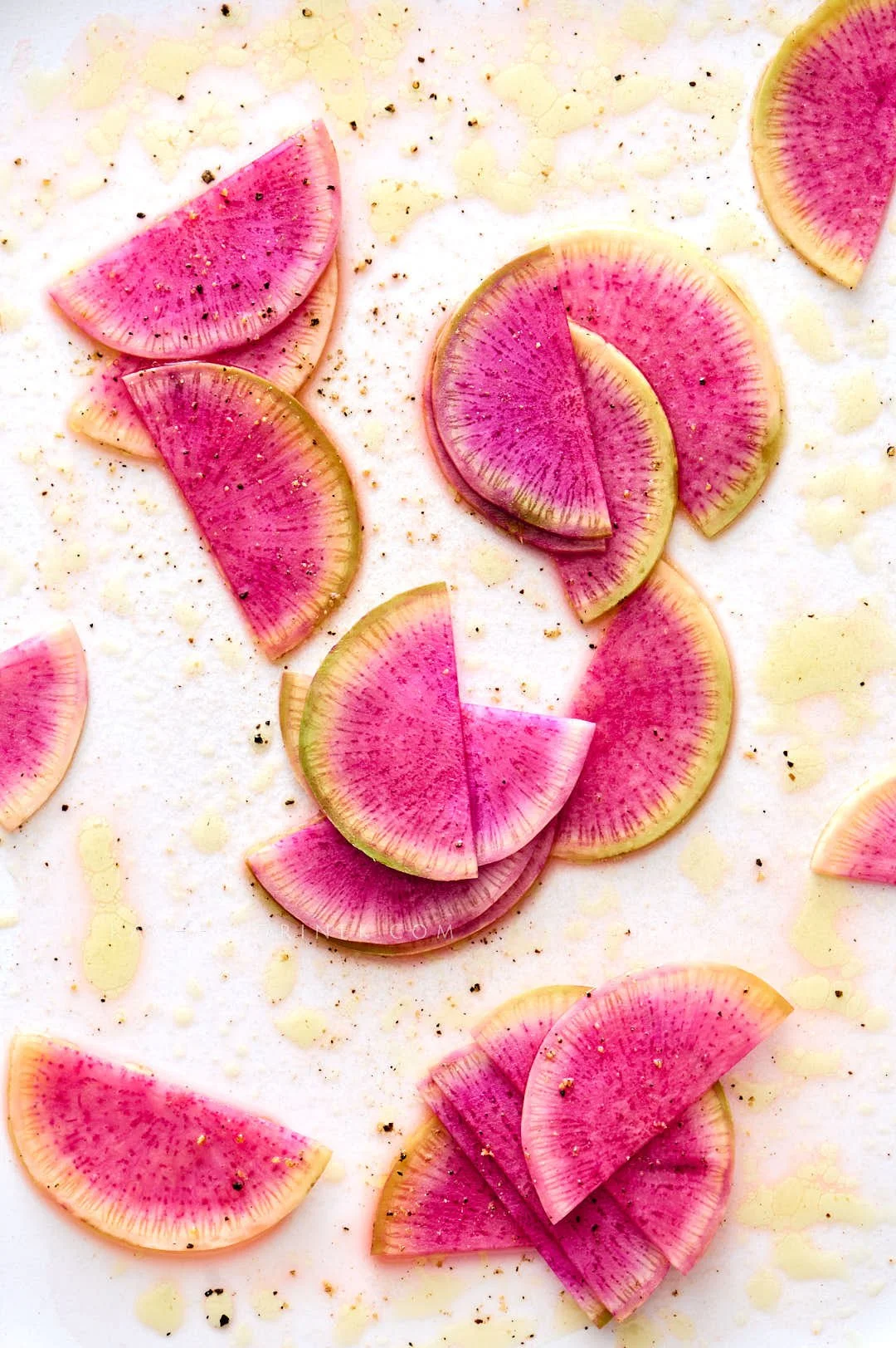  Scatter of pink radishes by food photographer Rachel Korinek, Toronto. 