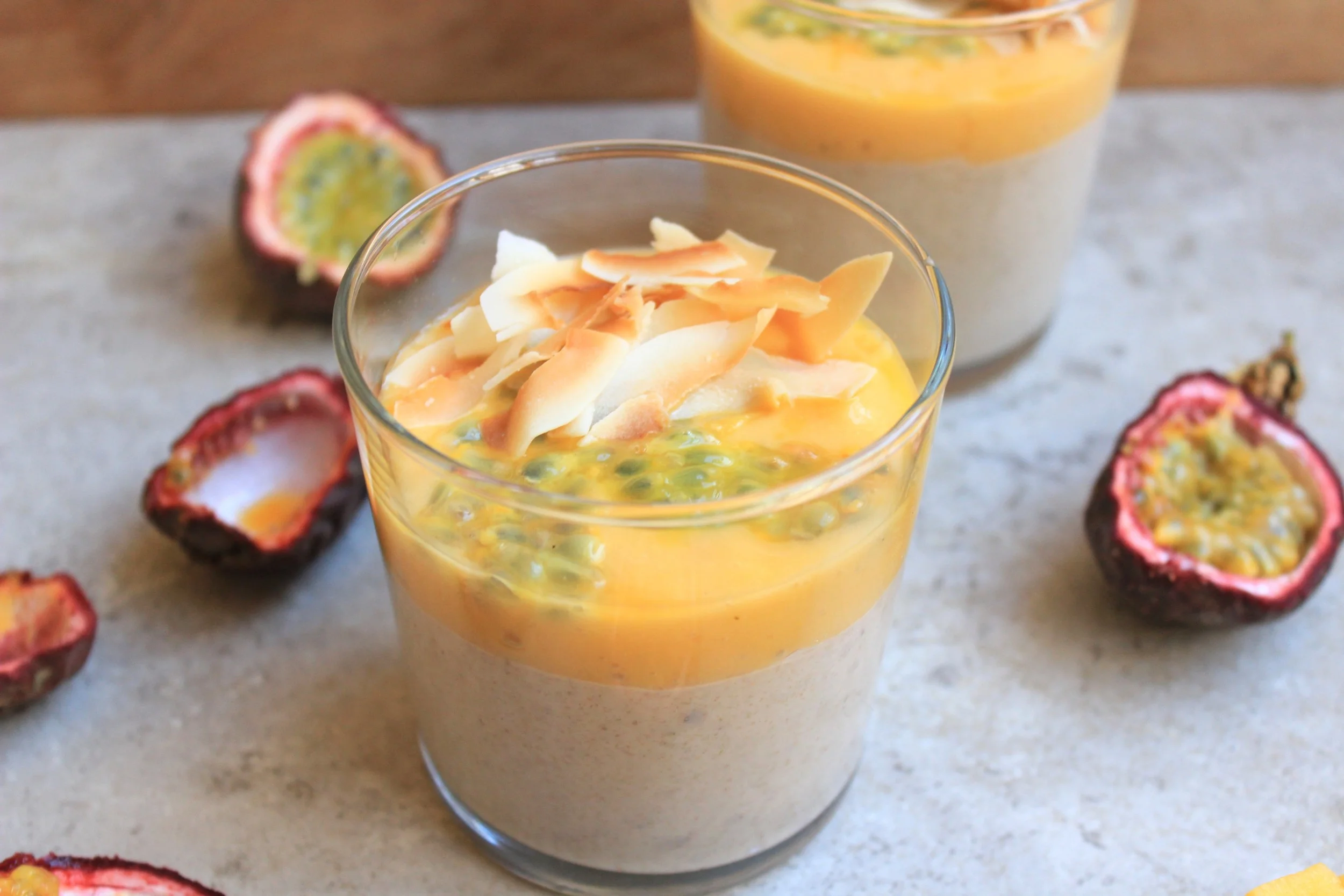 Creamy banana-coconut raw buckwheat porridge w/passion fruit-mango sauce & toasted coconut