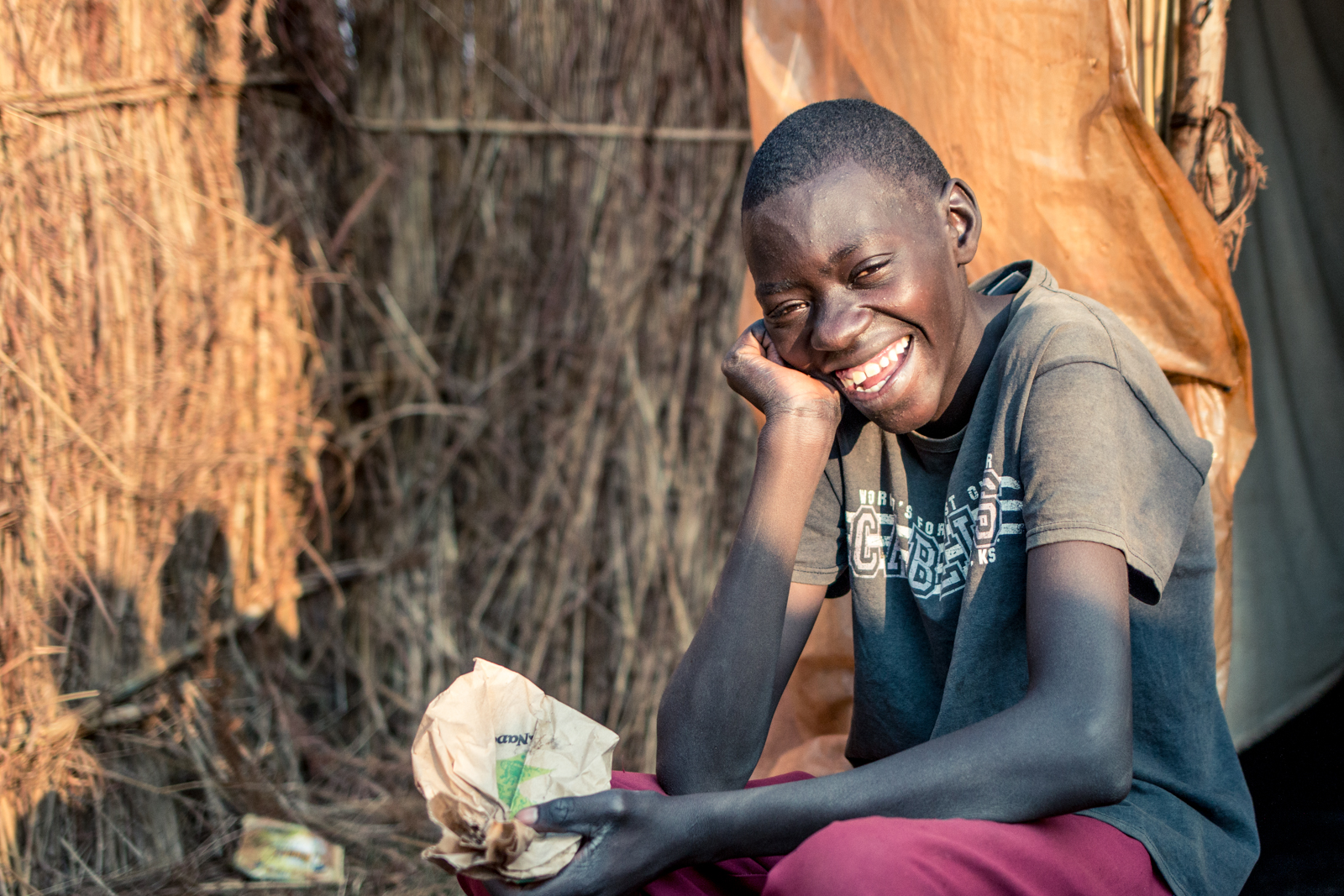  ZIMBABWE: [Home Visit] Eddy is Patricia's 21 year old son. 5 years ago, at 16, he was still yet to attend school, walk and talk because of his condition and weighed less than 60 lbs. Through the food and assistance Patricia received Eddy has rapidly