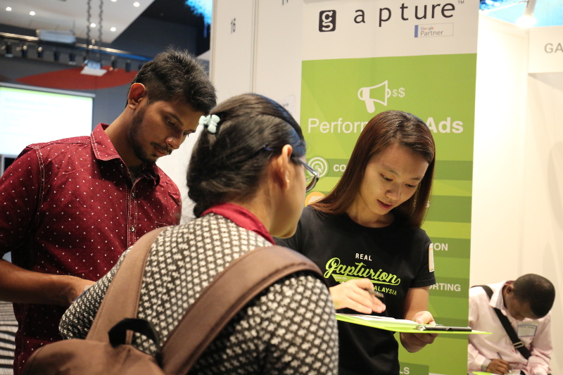 Gapturion intern Sook Yee checking the answers for the simple Digital Marketing test
