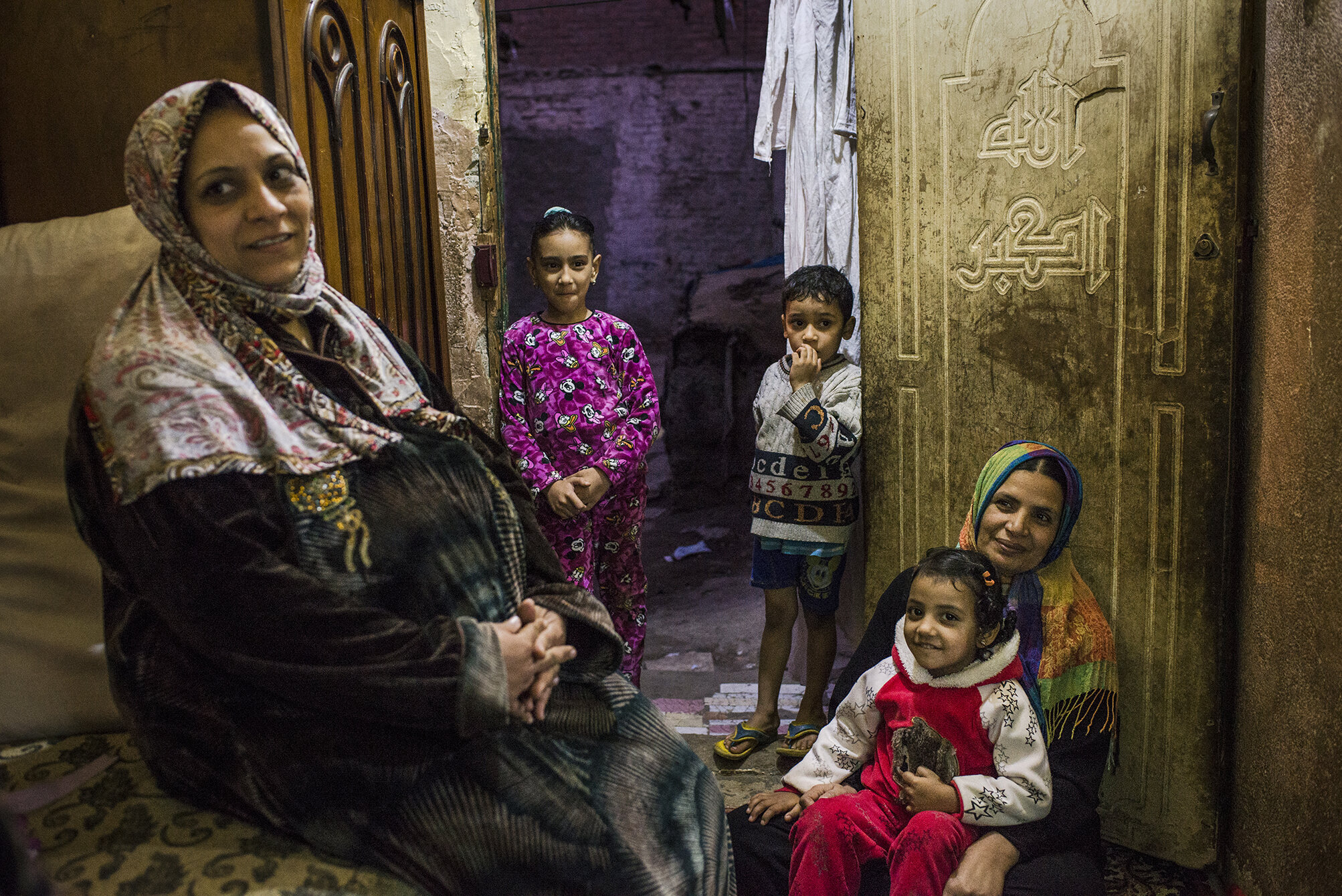 Magda (right) and Abir (left) are neighbours living in a slum area in the central Cairo. Magda works at a local gynaecological clinic and she tries to convince people around her against FGM. Abir however is planning to circumcise her 12 years old daughter. In traditional communities clitoris is perceived as source of desire and excitement; thus; it is necessary to cut it off for the girls to remain morally correct. December 2018; Cairo; Egypt