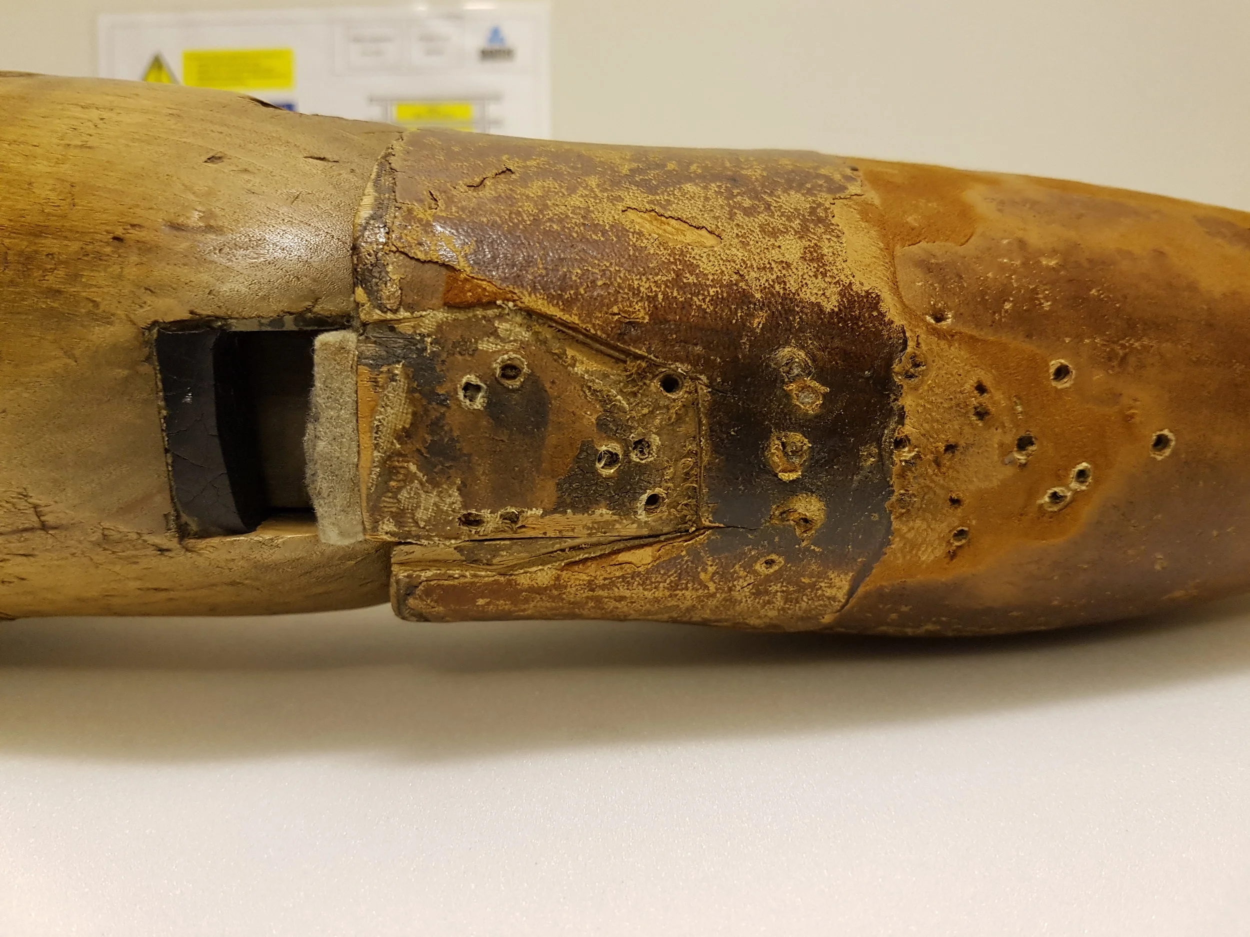 Wooden right above-knee prosthesis made for a 16-year-old solider in 1894. He wore it continuously and made multiple home repairs to it until he was (very reluctantly) supplied with a new one in 1972. (Object number 1999-469, made in 1894, © Science Museum, photograph by Harriet Barratt)