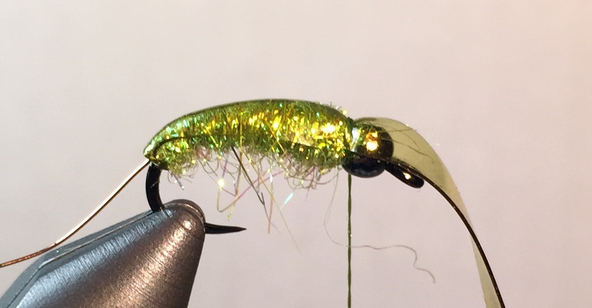 Step 4: Pull the body glass tight across the back of the fly to the bead and use sever loops and a hitch to secure.