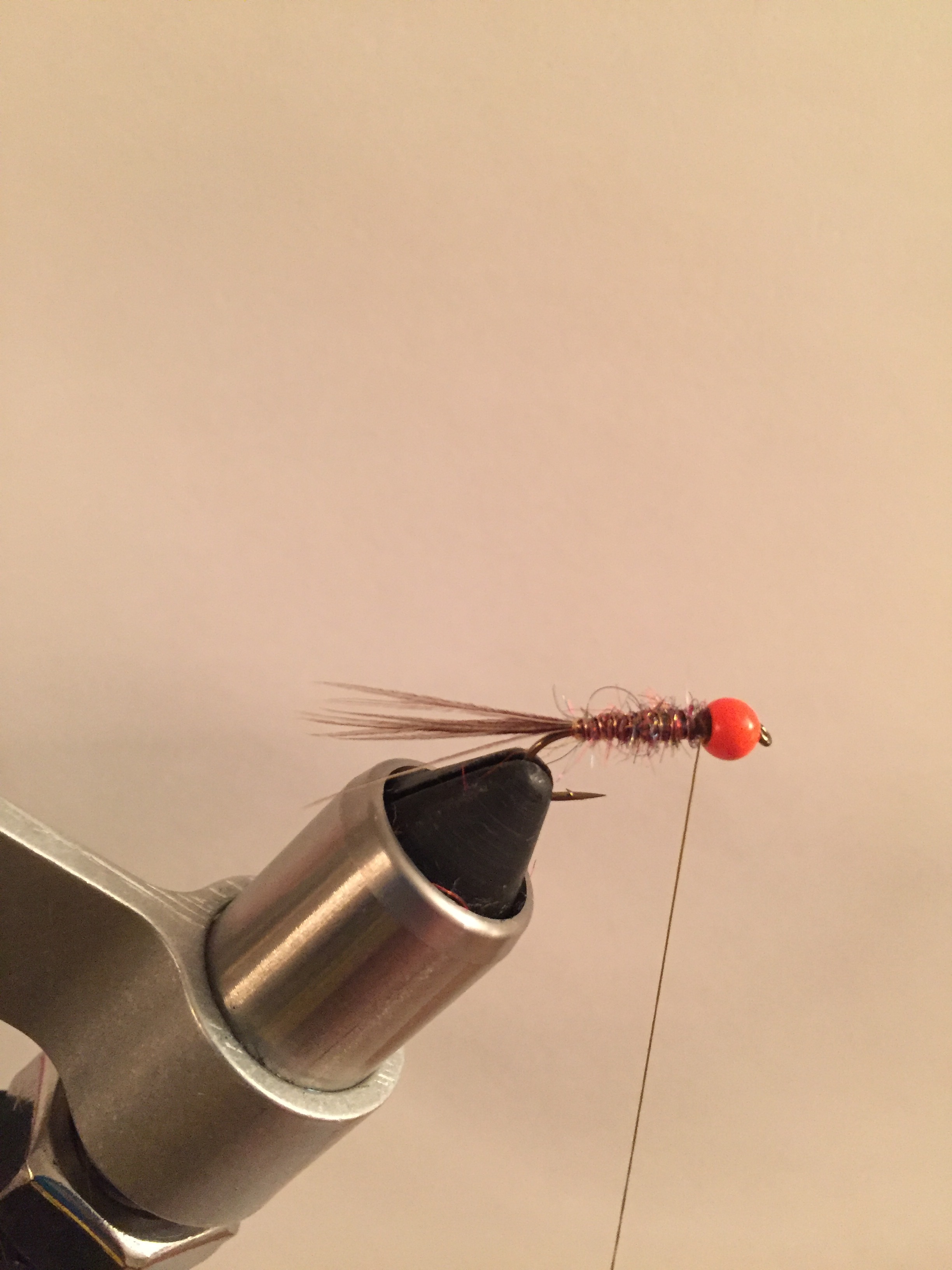 Step 4: Wrap the copper wire in the opposite direction as the dubbing up to the bead. Tie off the copper wire and neatly trim any out of place dubbing on the body. A little bushiness is encouraged.