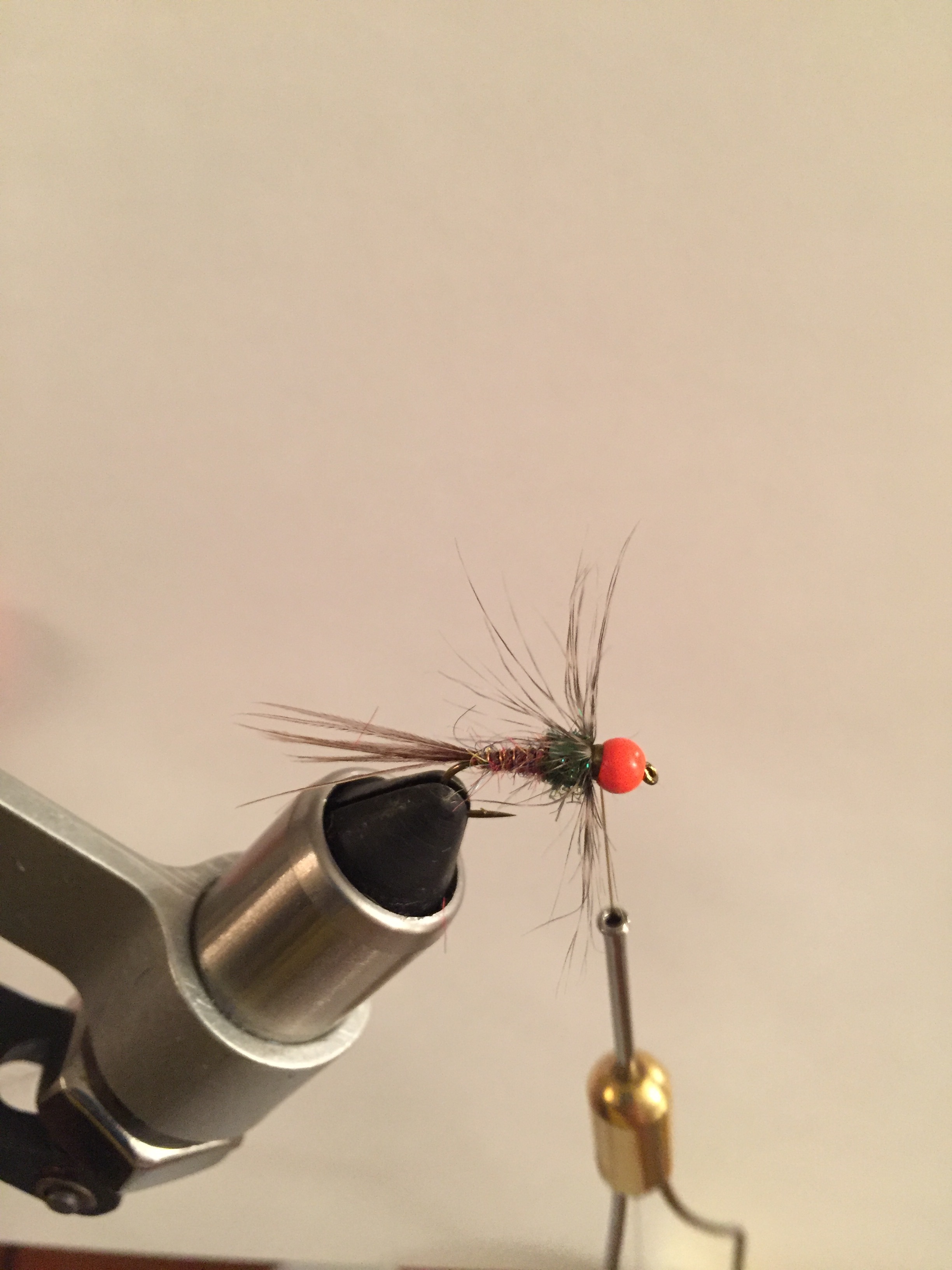 Step 7: Finally, tie in the soft hackle and make 2 quick wraps. Stroke the fibers rearward and give them wraps to anchor them in place. Trim off tag end of hackle. Whip finish and apply a small amount of zap a gap for durability as this fly will get hammered when fished properly.