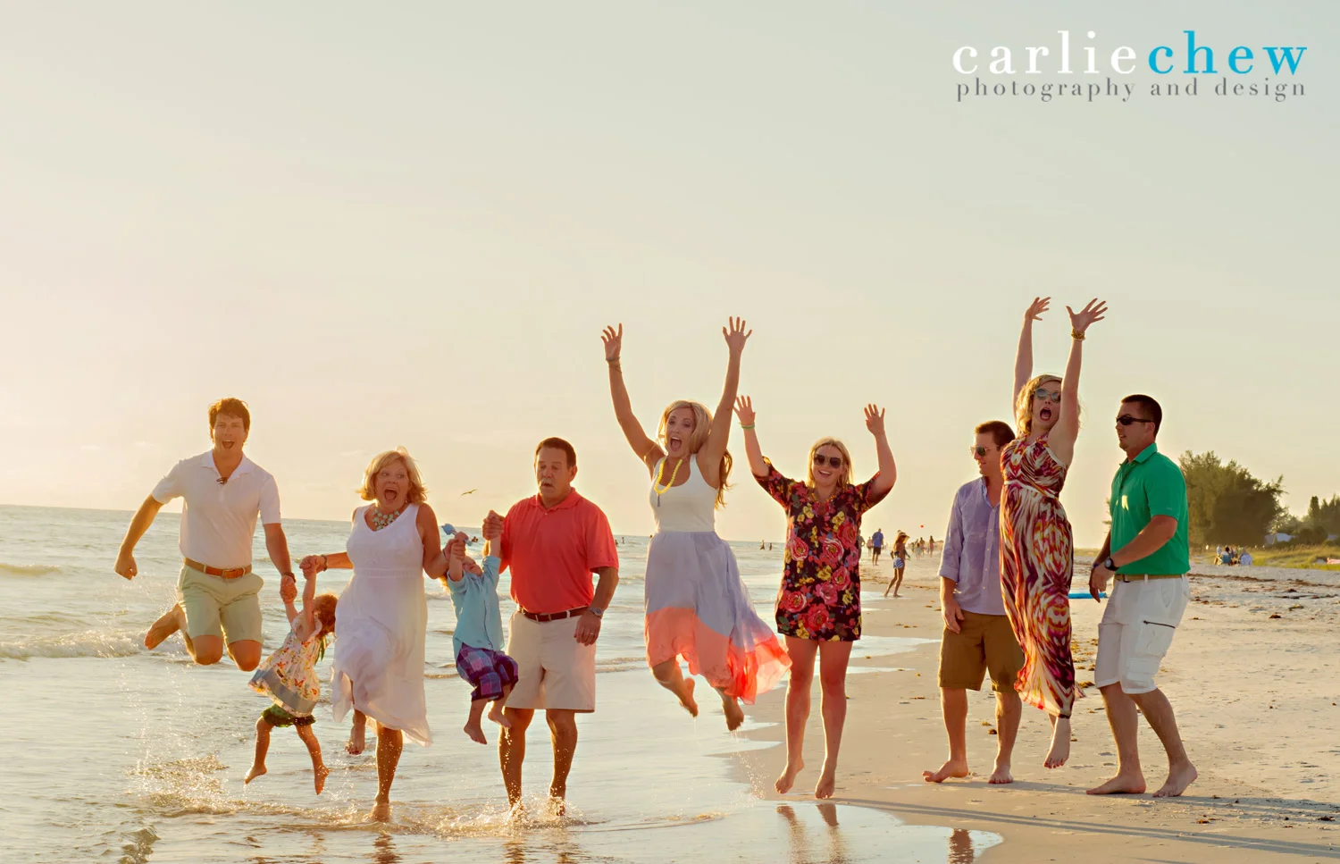 Family jumping at beach for portrait photography on Anna Maria Island, Florida by Carlie Chew