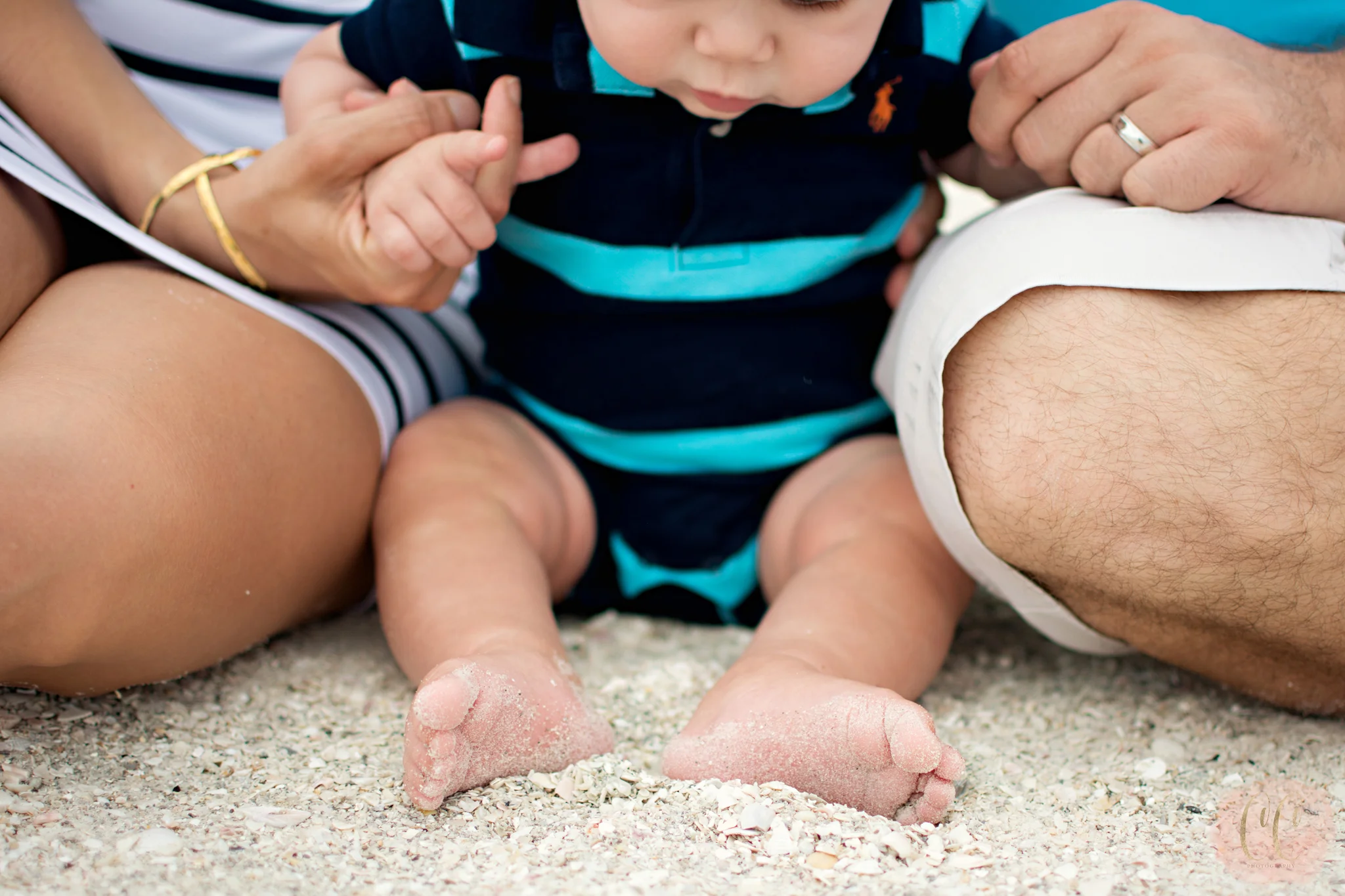 Baby feet at Sand Key Beach in Clearwater, Florida taken by family photographer Carlie Chew Photography 
