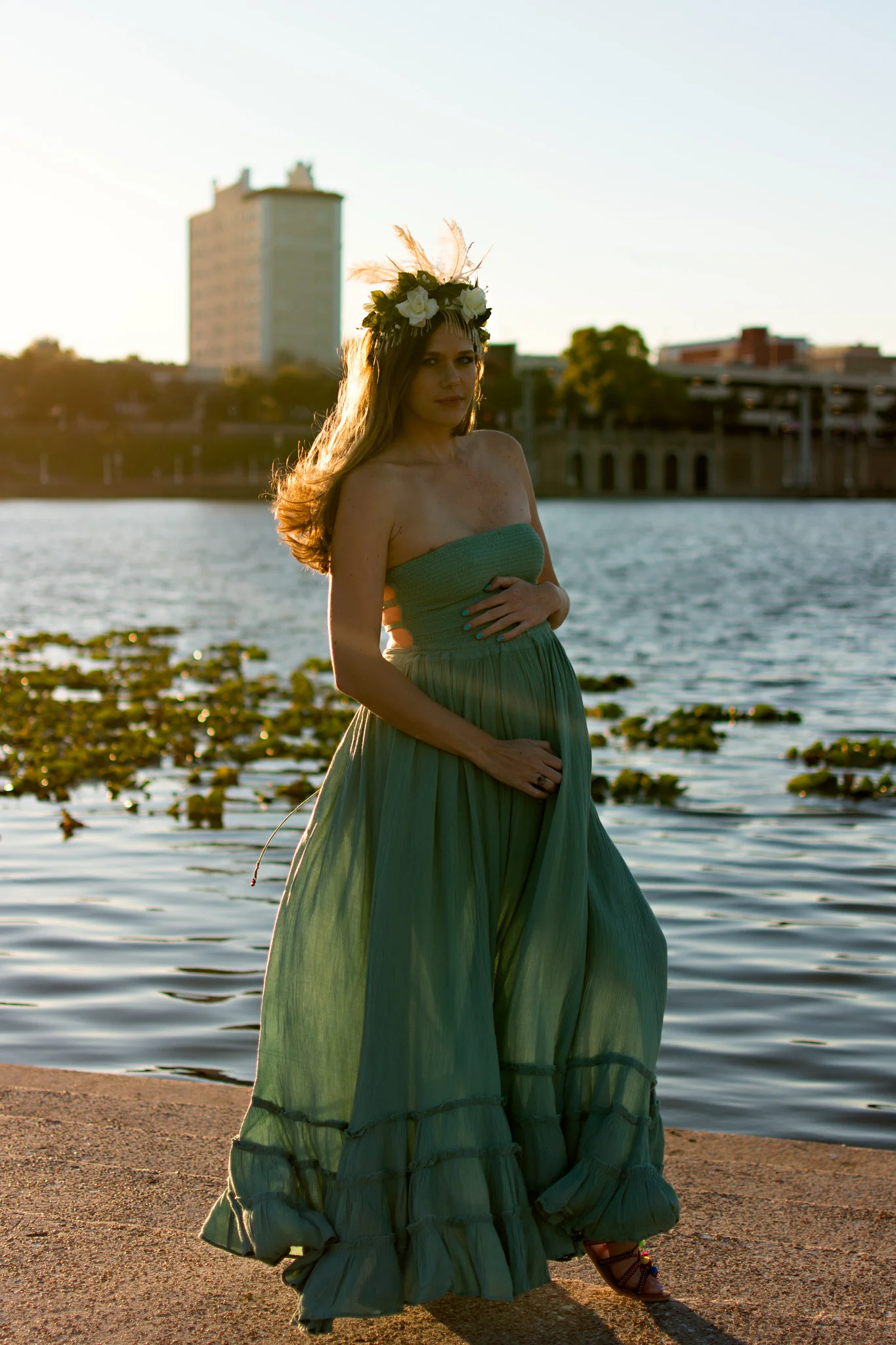Mom to be with sunset backdrop at Mirror Lake for maternity photos with Carlie Chew Photography in Lakeland Florida 