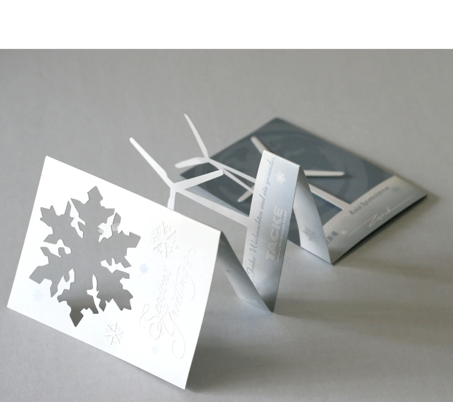  The card begins to unfold, unveiling the wind turbine shapes 