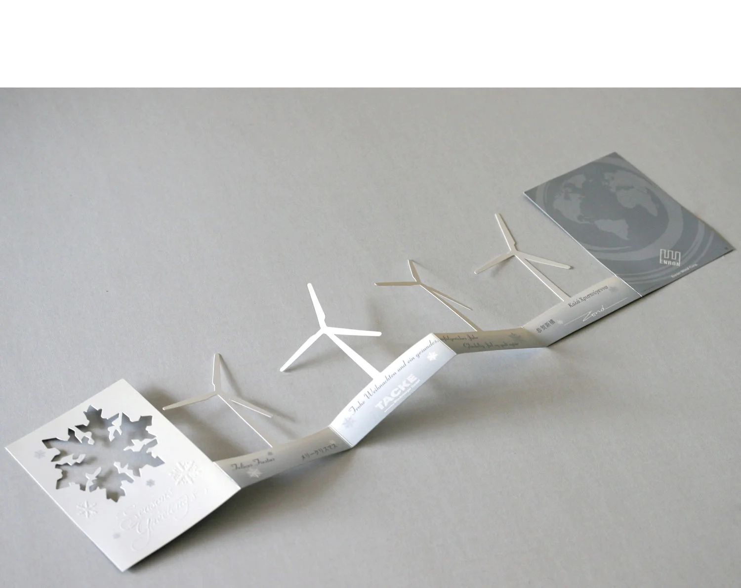  The card is laid flat, unveiling all four turbines, each with varied blade angles 