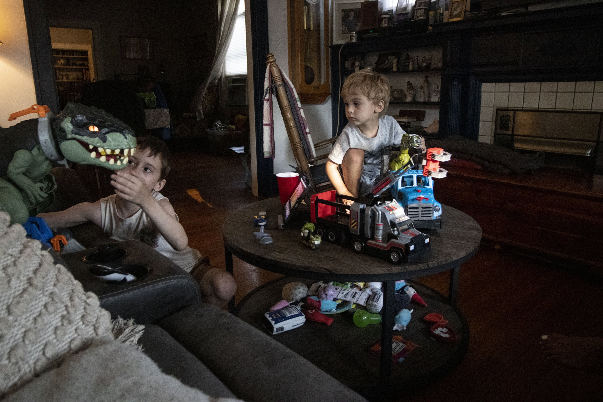  Layton Moss, 7, left, and Sheperd Moss, 3, right, play in the living room of their family home. Layton has more memories of his grandmother than Shepherd, but both grieve in their own ways. 