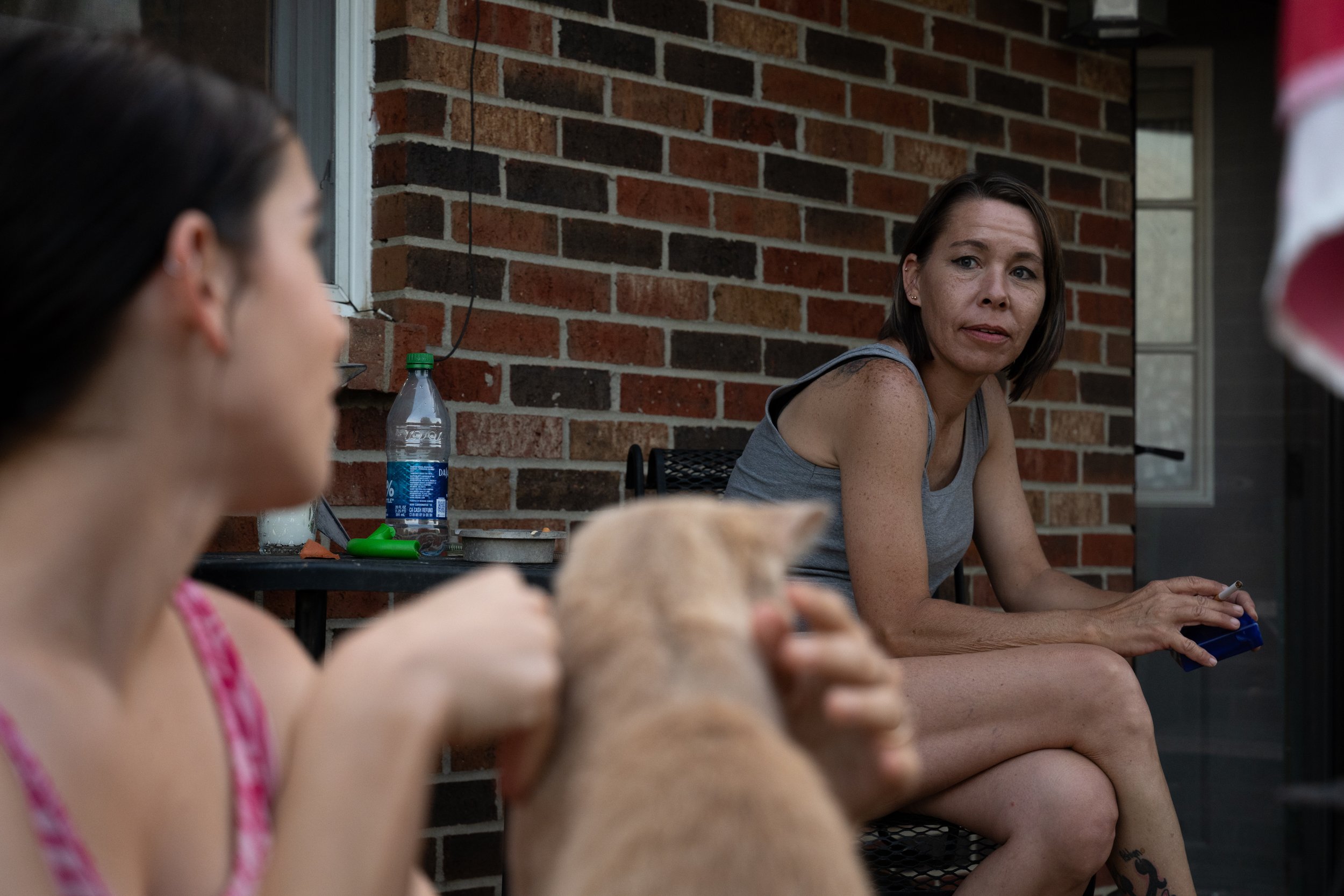  7/7/23 -- Cynthiana, Kentucky —  Nicole McNees, right, looks at her daughter Ashlynn McNees, 18, on their back porch in Cynthiana, KY on July 7, 2023. 