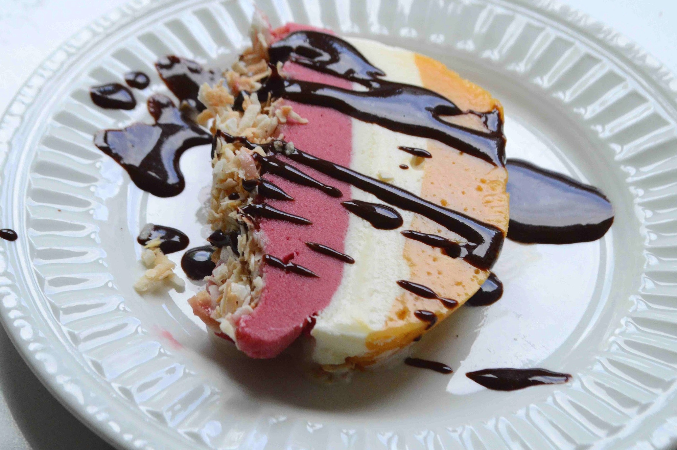 Frozen Mango, Raspberry and Vanilla Terrine with Toasted Coconut and Chocolate Sauce