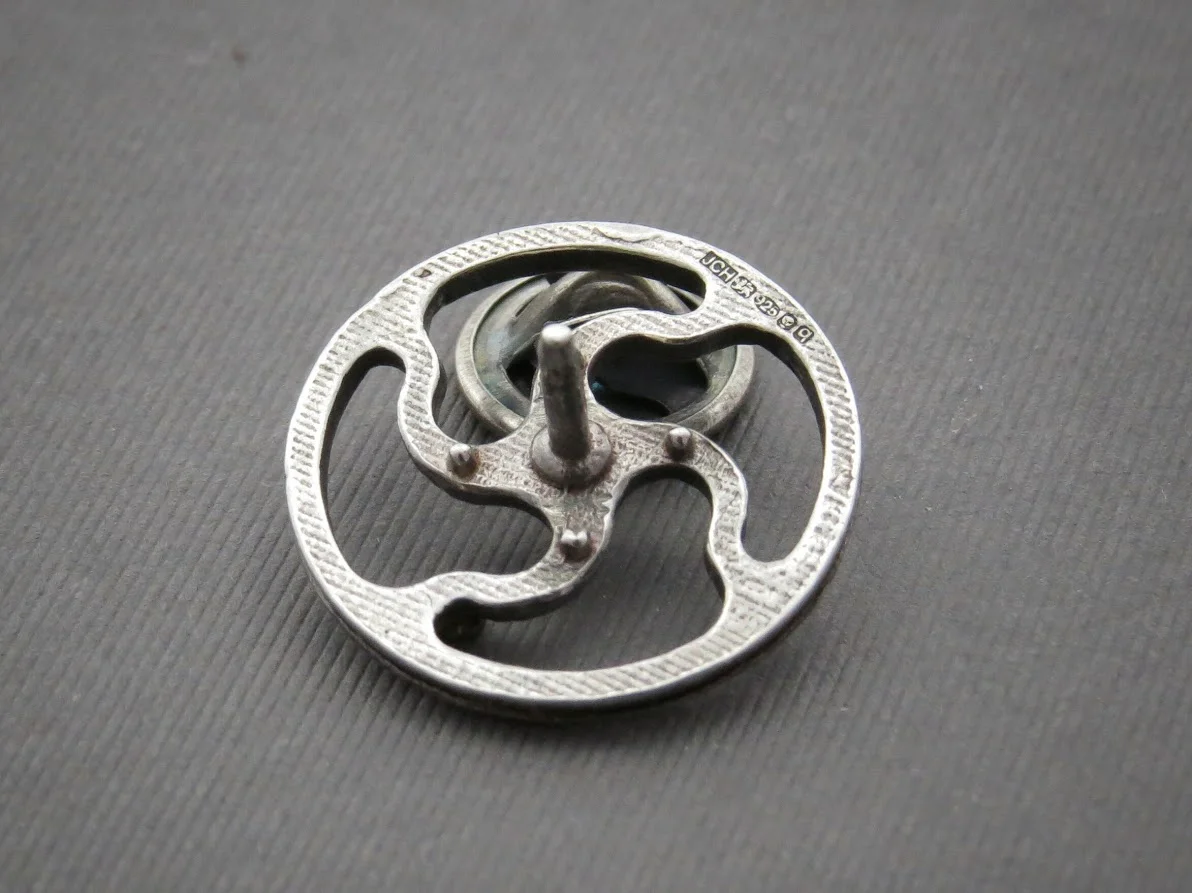 Silver topping tool pin back.jpeg