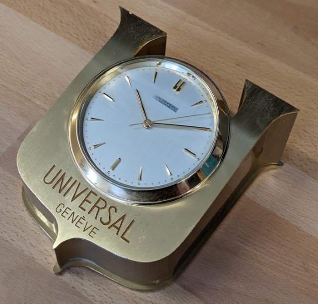 Universal Geneve Advertisement Clock, gold plated logo case with Portescap electric clock movement