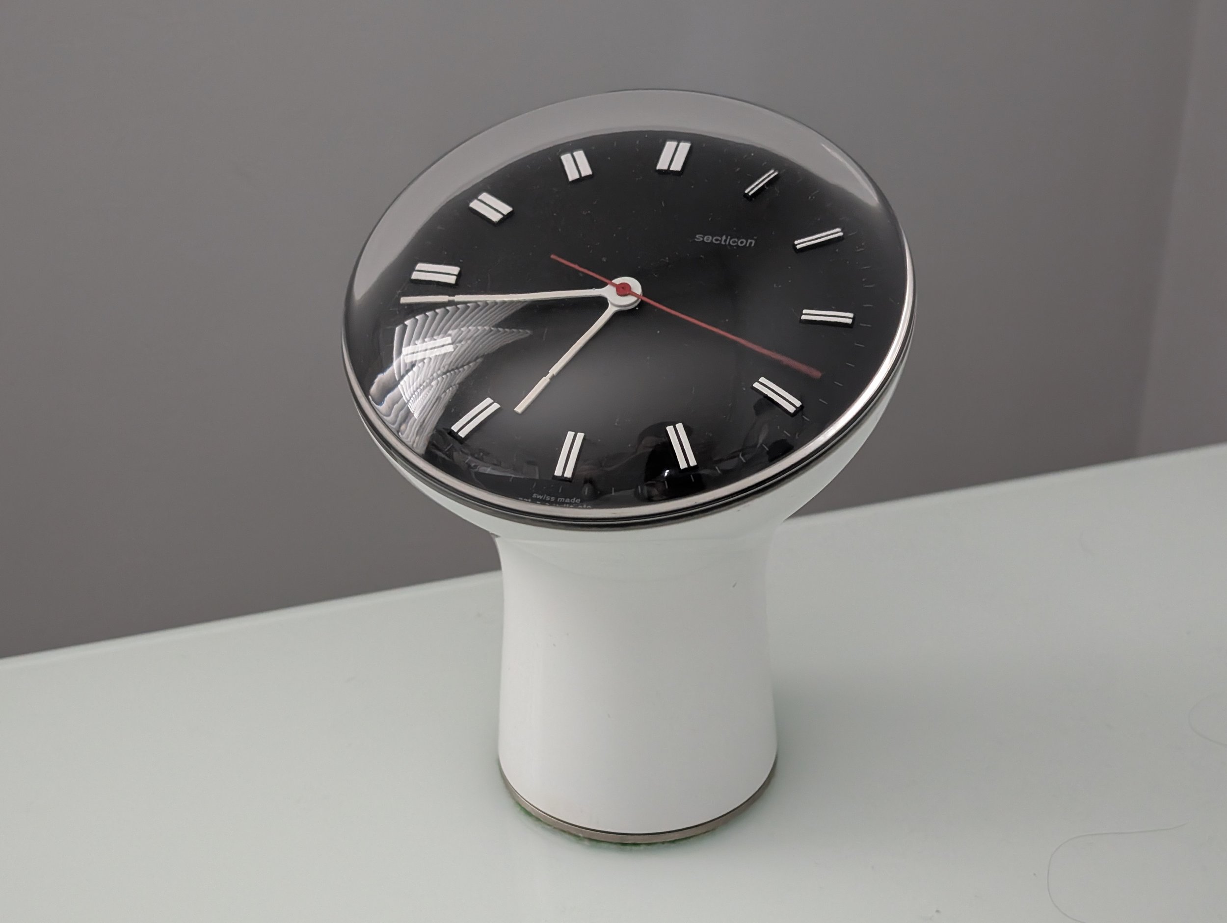 Secticon Clock designed by Angello Mangiarotti in white plastic with domed acrylic crystal and Portescap electric clock movement