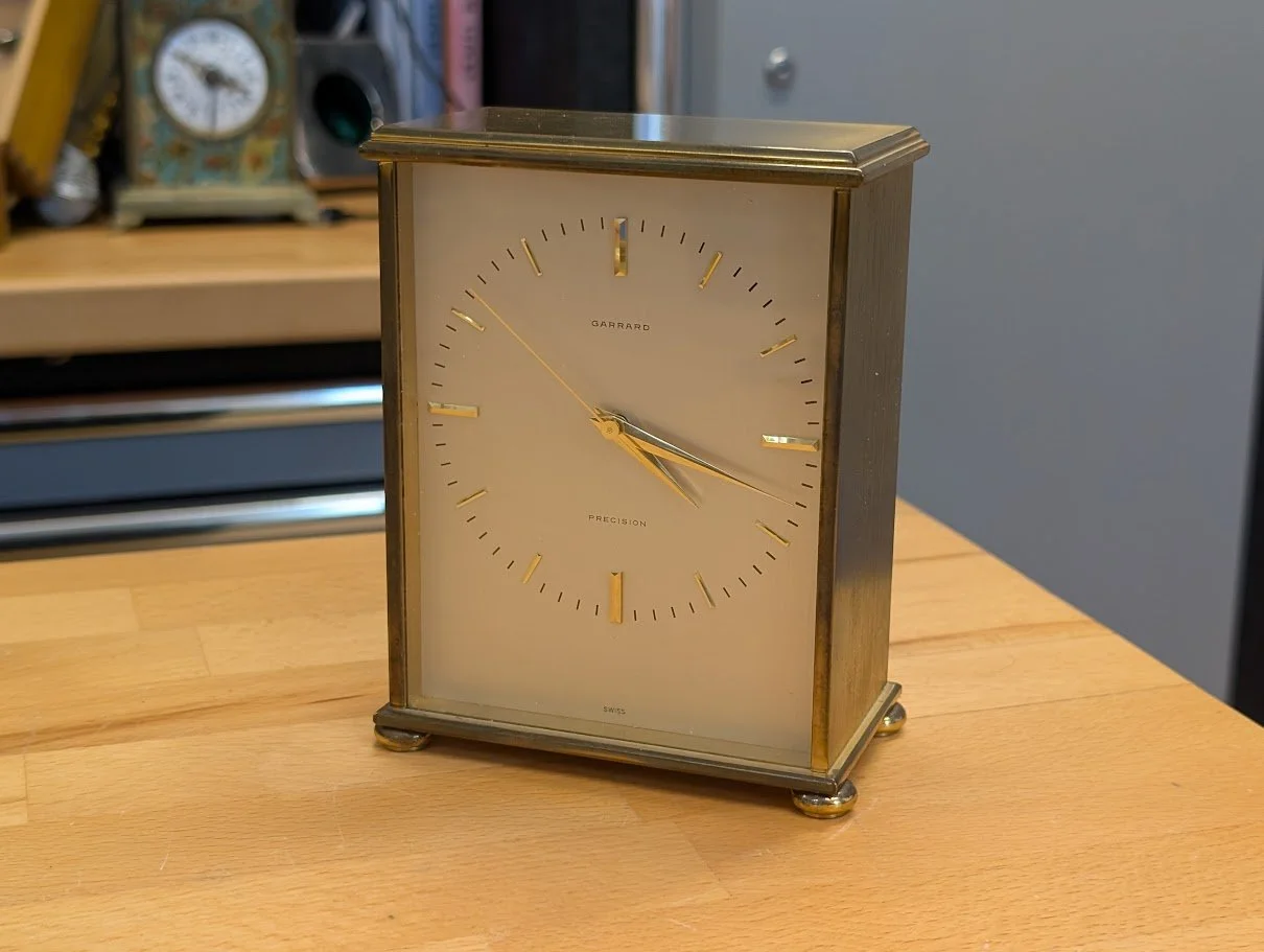 Garrard brass-cased mantle clock with silvered dial and Portescap electric clock movement
