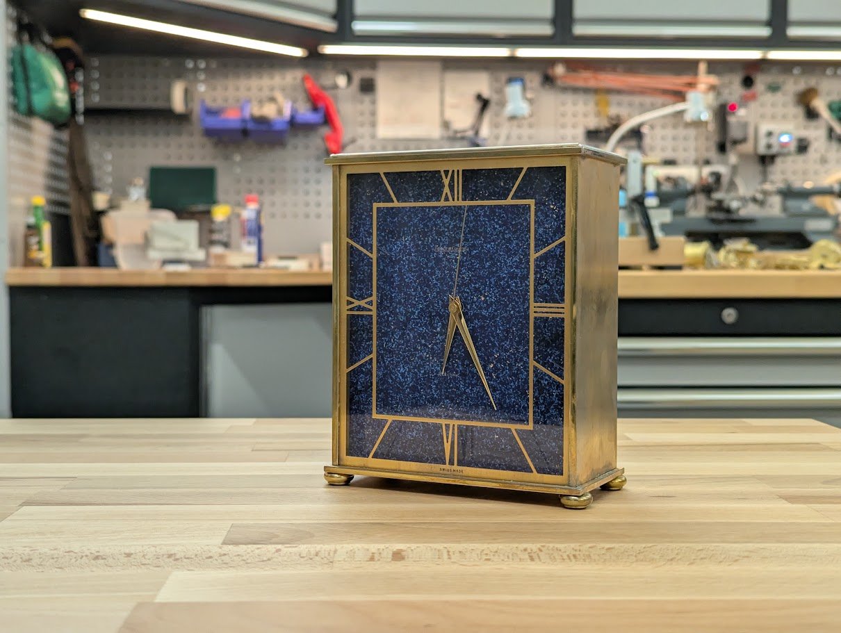 Le Coultre mantle clock with Lapis effect painted dial, skeletonised chapter ring and Portescap electric clock movement