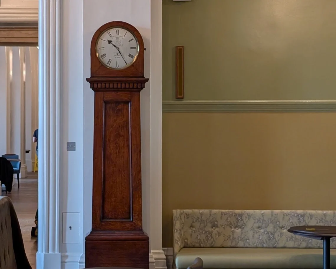 A Vulliamy longcase clock in a wallnut case