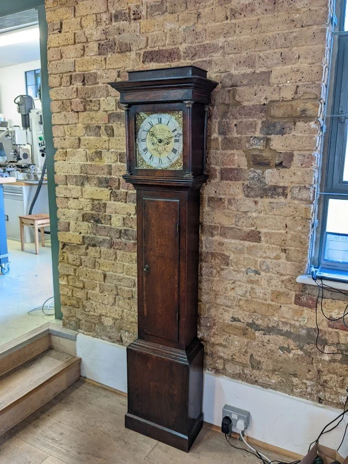 A recently repaired longcase clock on test waiting to be returned to the customer.