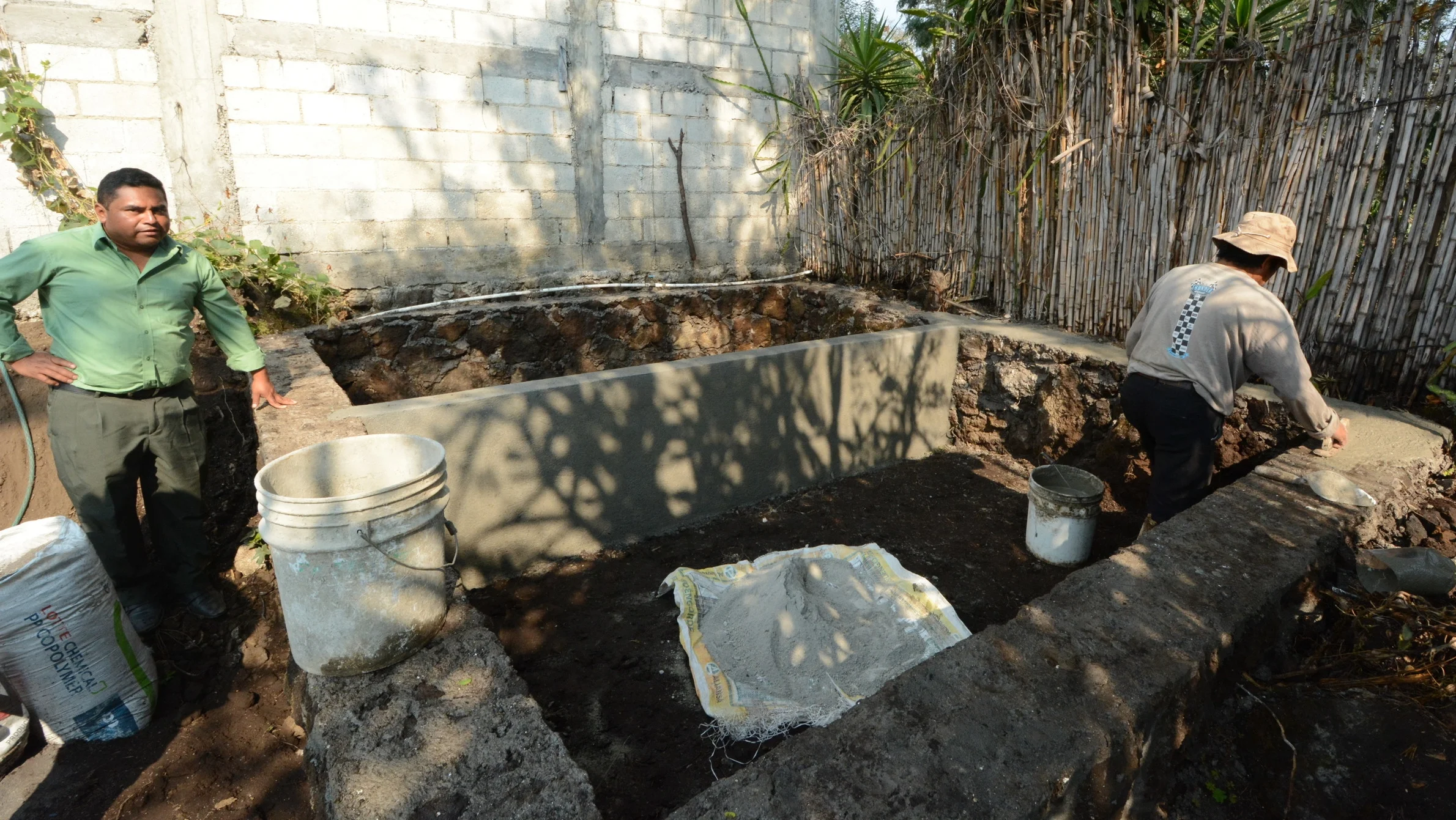 Finishing touches to La Cumbre's worm composting system. Lots of room for worms and the compost they make.
