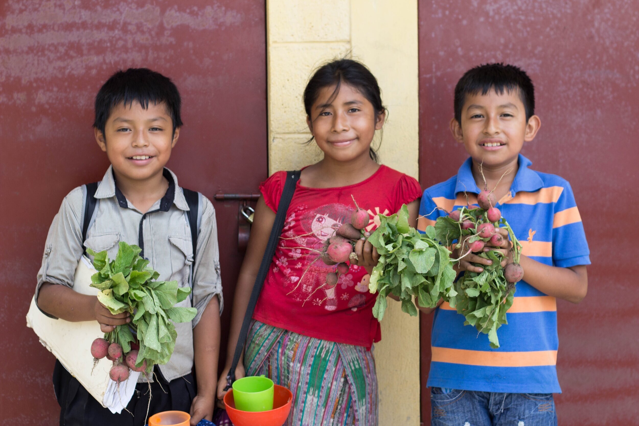  Students with harvest from their organic school garden    