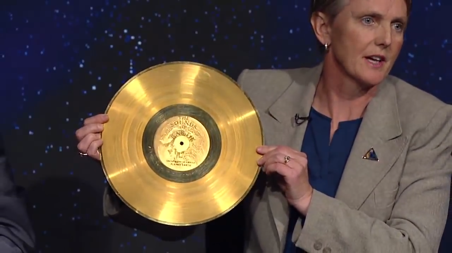 Voyager Project Manager Suzanne Dodd holds a copy of the Golden Record. Photo Credit: NASA