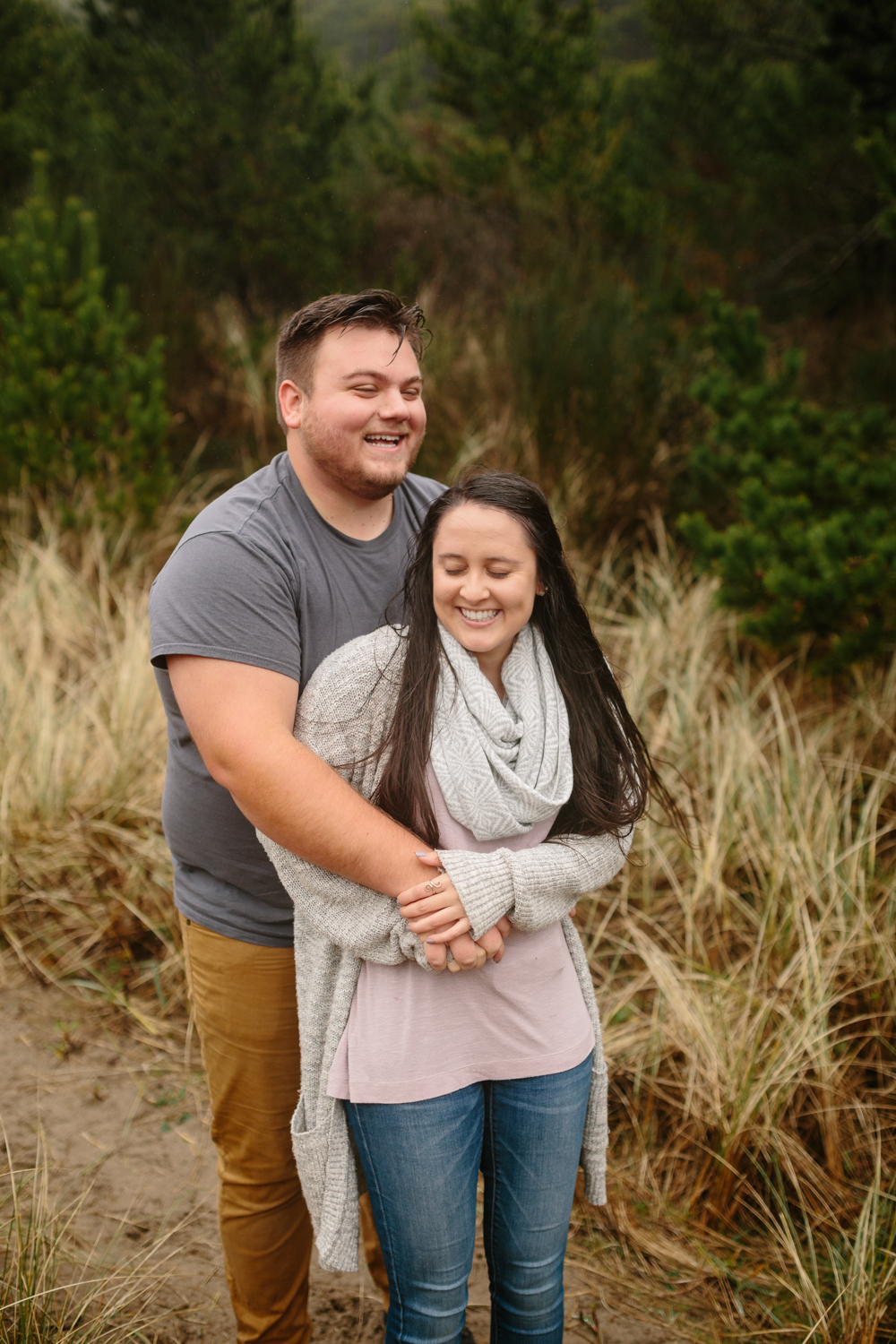 A young couple laughing during their photo shoot