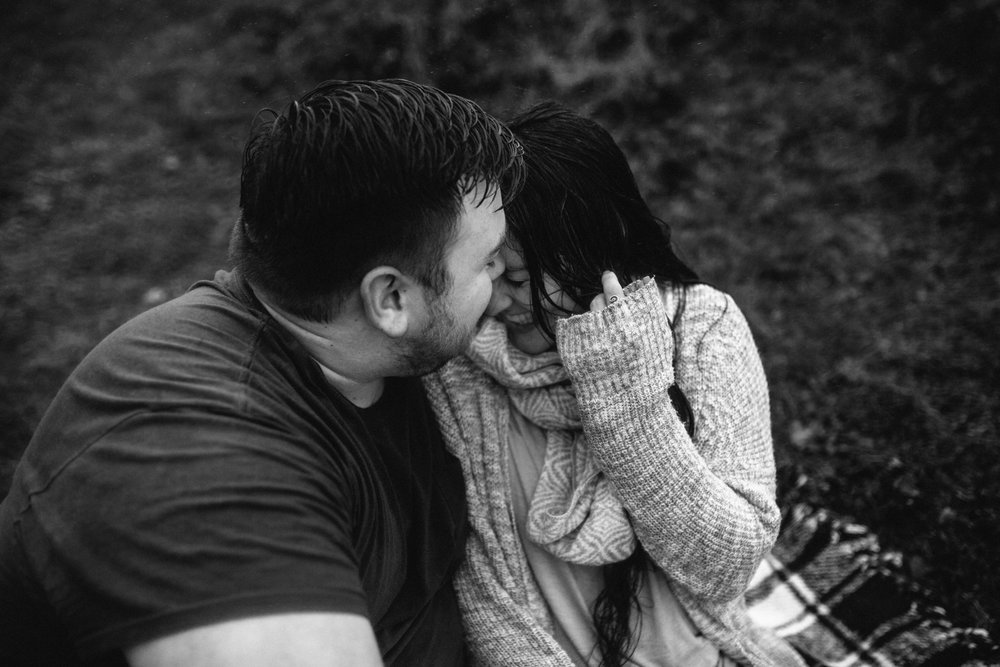 Portrait of a young man making his girlfriend laugh