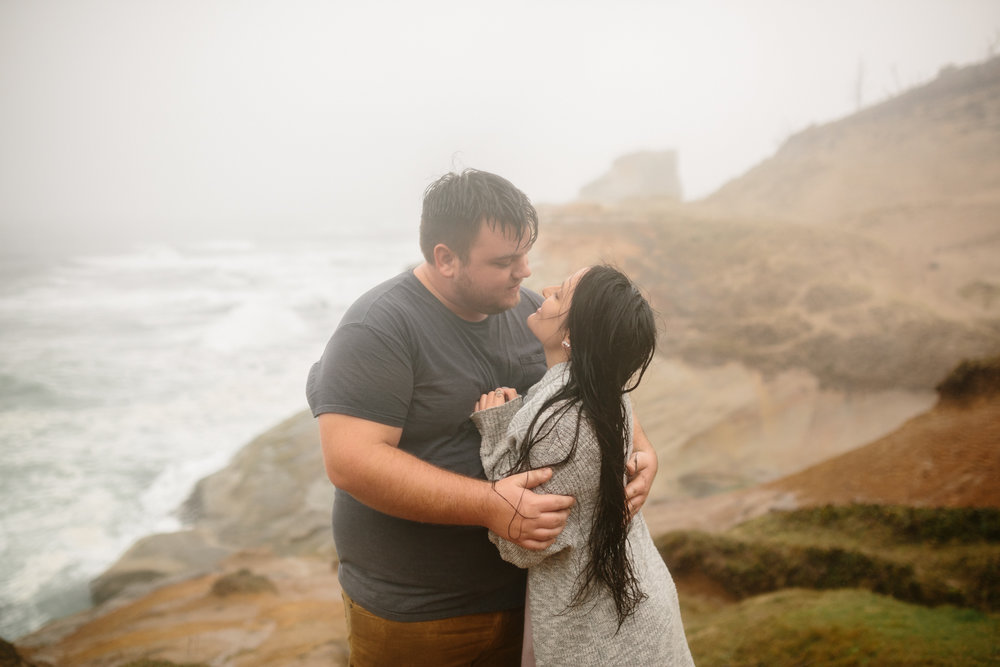 A young man leaning in for a kiss and keeping his girlfriend war