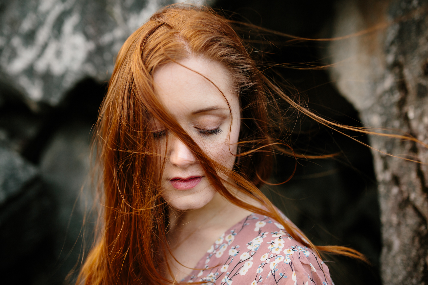 Windblown Portrait of a Beautiful, Red-Haired Woman Sitting Amid