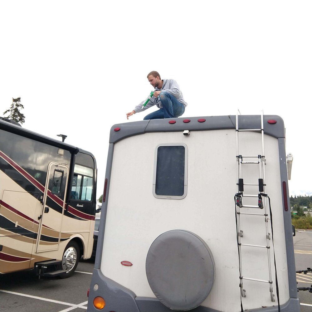 Ty+calking+our+RV+skylight.jpg