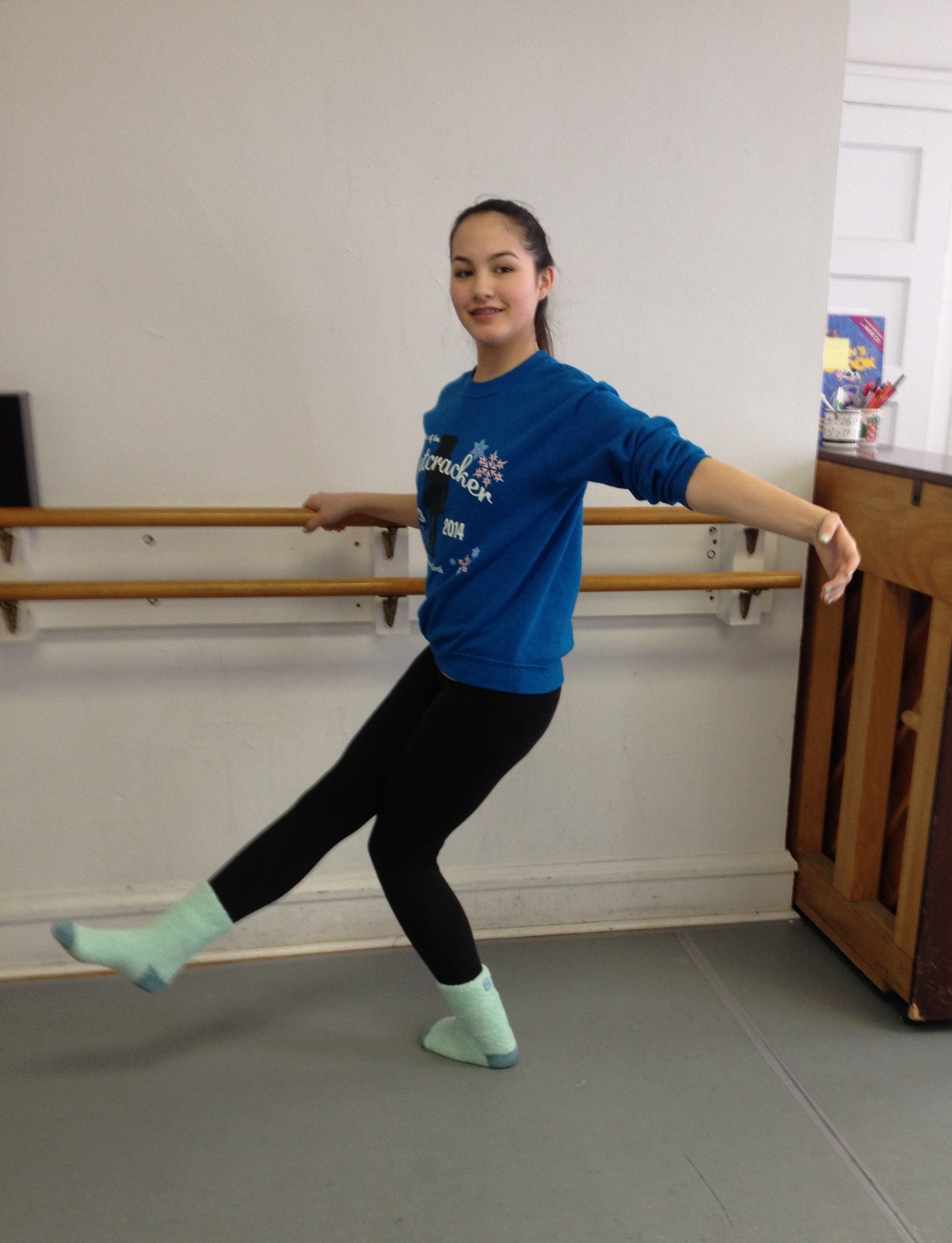 Stand on your left leg facing the barre and place your right hand on the barre. Then gently circle your left hand and right foot "around the corner" to the left until you feel a little bit of stretch in the outside of the left hip. Gently bend your left knee and keep your left foot planted, toes forward. Repeat 5-10 times as needed, then reverse to the other side. Please discontinue this exercise and consult your doctor or physical therapist if you feel pain.