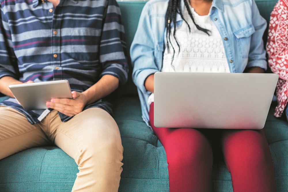 Cropped man and woman using electronic device free image