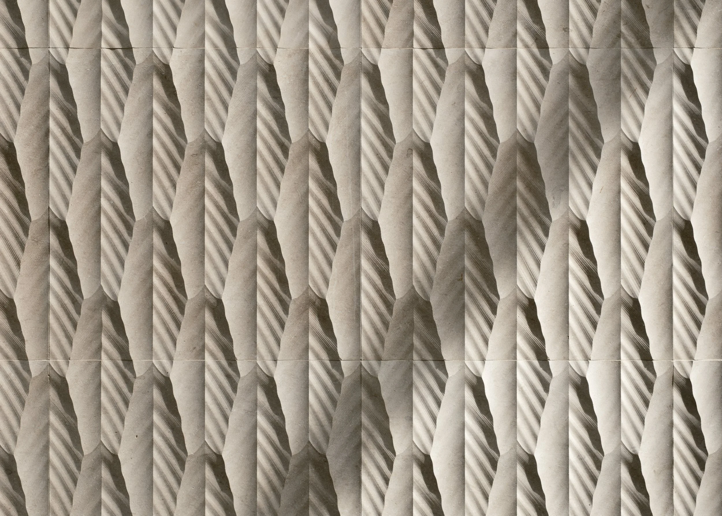 A close-up of a fence with alternating light and dark vertical wooden slats.