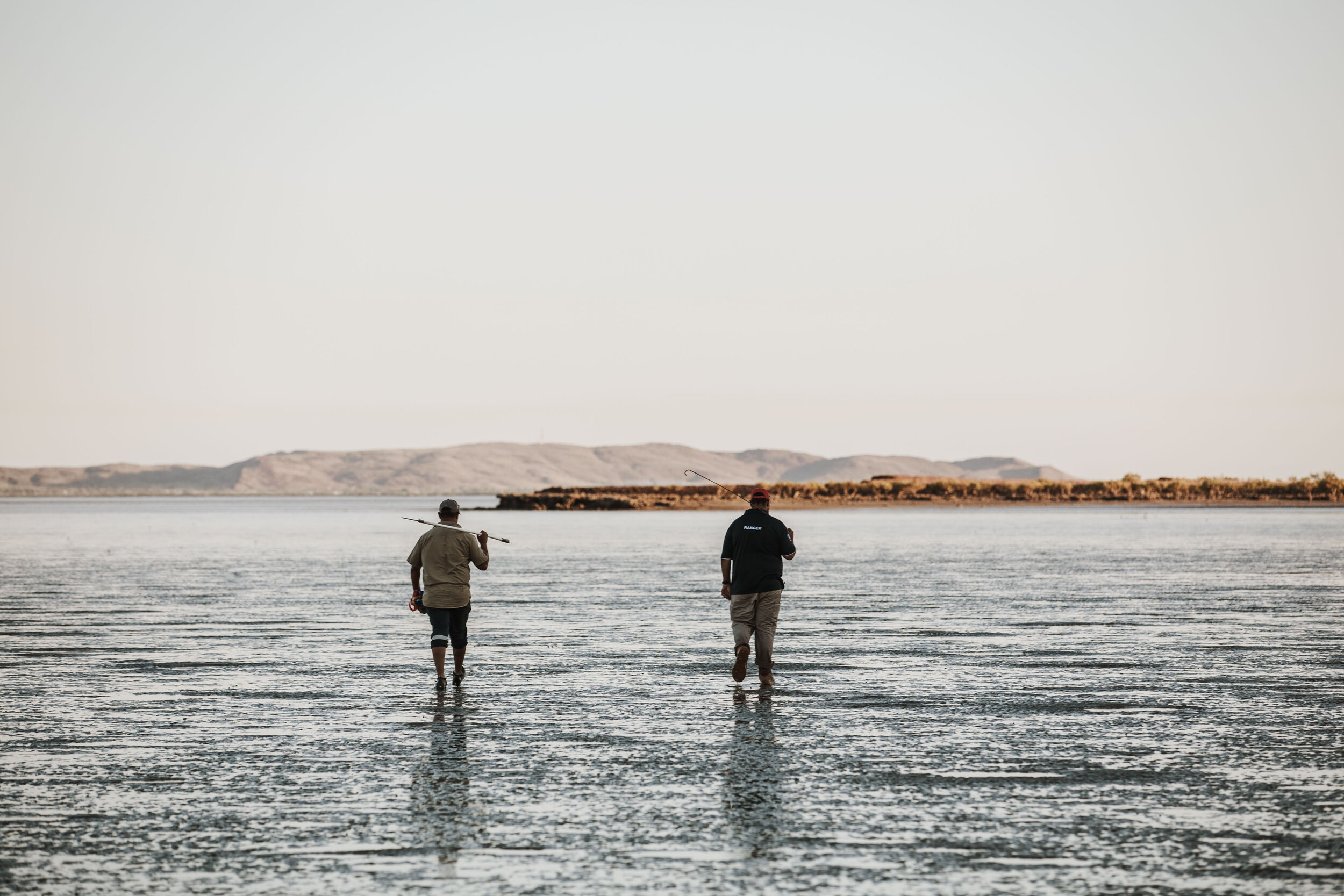  Clinton and his nephew out Mud Crabbing during low tide at Turtle Island. 