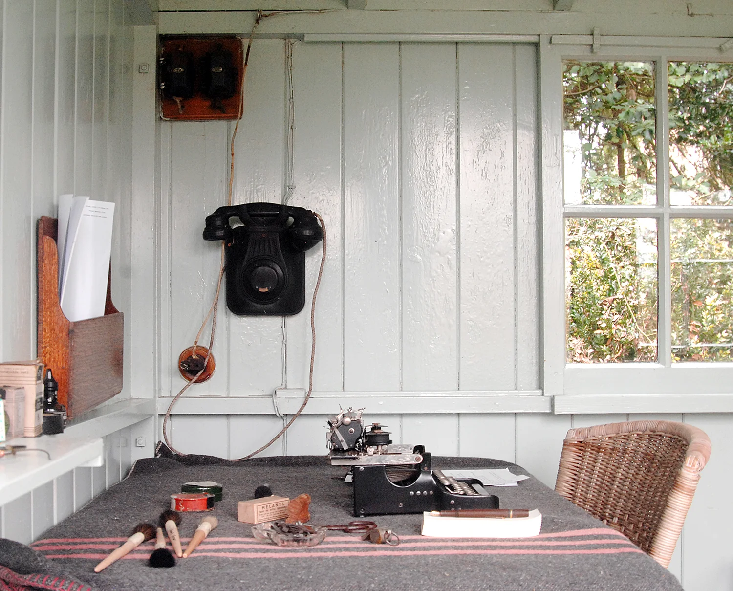 Interior of George Bernard Shaw's rotating writing shed at Shaw's Corner. He used the telephone to contact his wife in the main house.