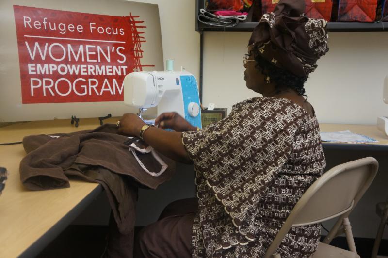 Bingi Shabani, from the Democratic Republic of Congo, is making a jacket that will be modeled in the upcoming Women's Fashion Show and Tea.