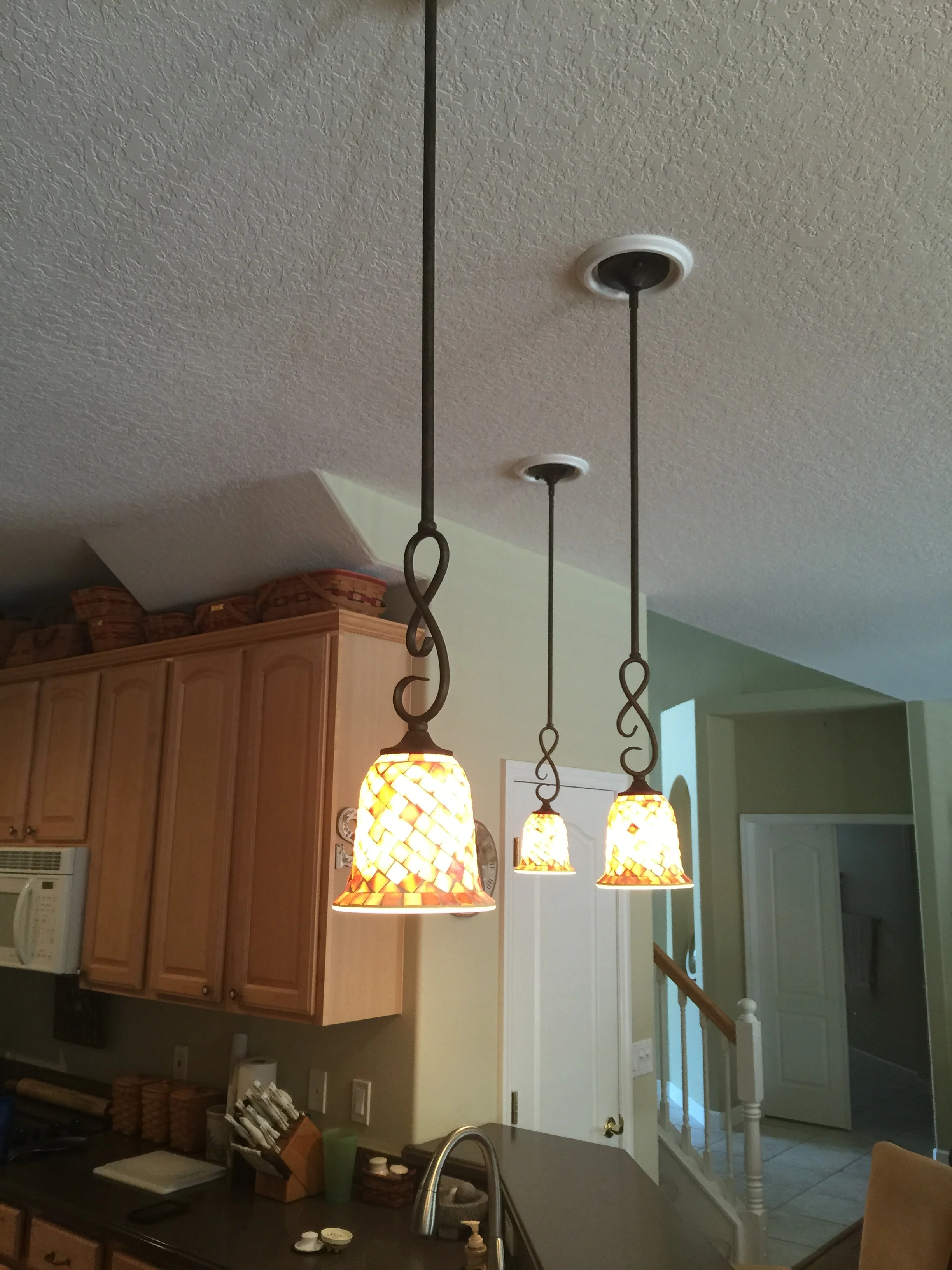 Recess cans converted into pendant lights.