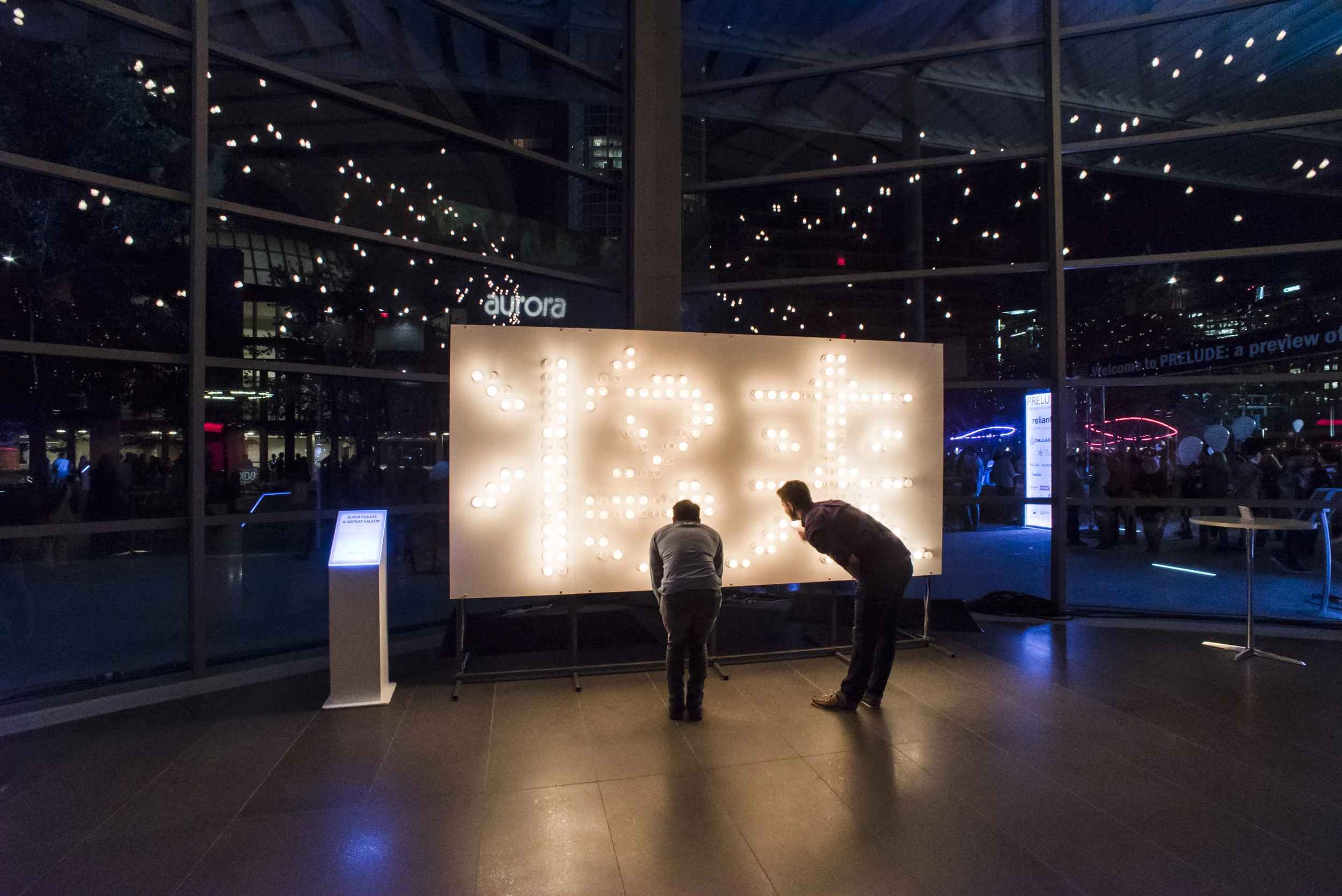 The Future at Dallas Aurora. The first three sculptures in the series illuminate the overall state of peace, death penalty and marriage equality around the world. The number of light bulbs suspended in the air corresponds to the total number of bulbs that remain unlit on all three signs, representing the potential for a brighter and more peaceful future. Photos: Dallas Aurora and Mike Fleming.