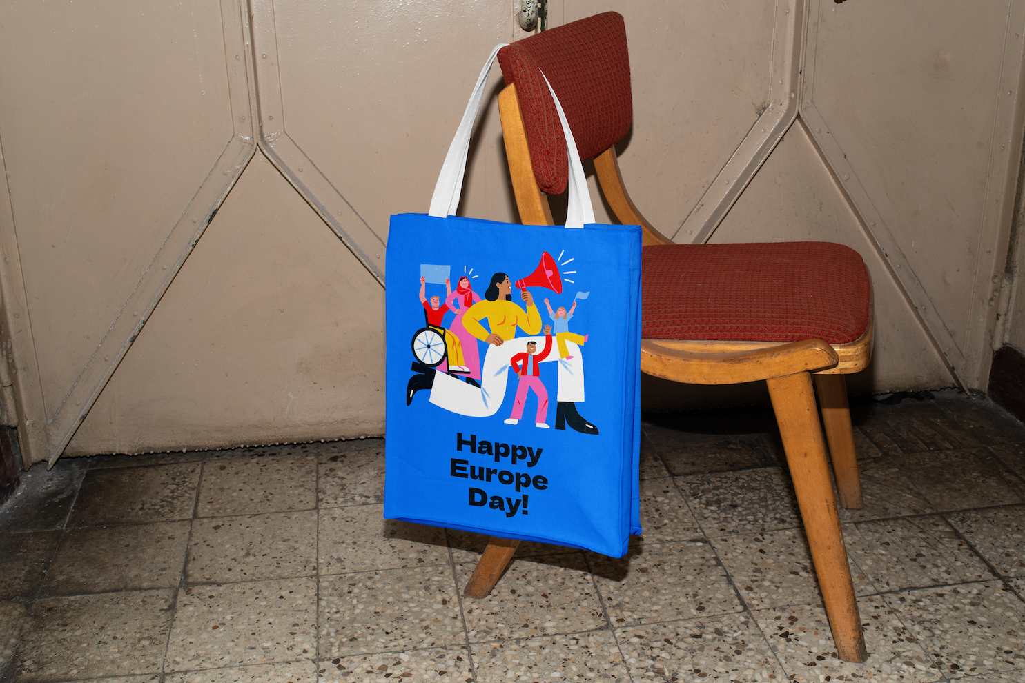 Free Canvas Bag Hanging on Chair Mockup.png